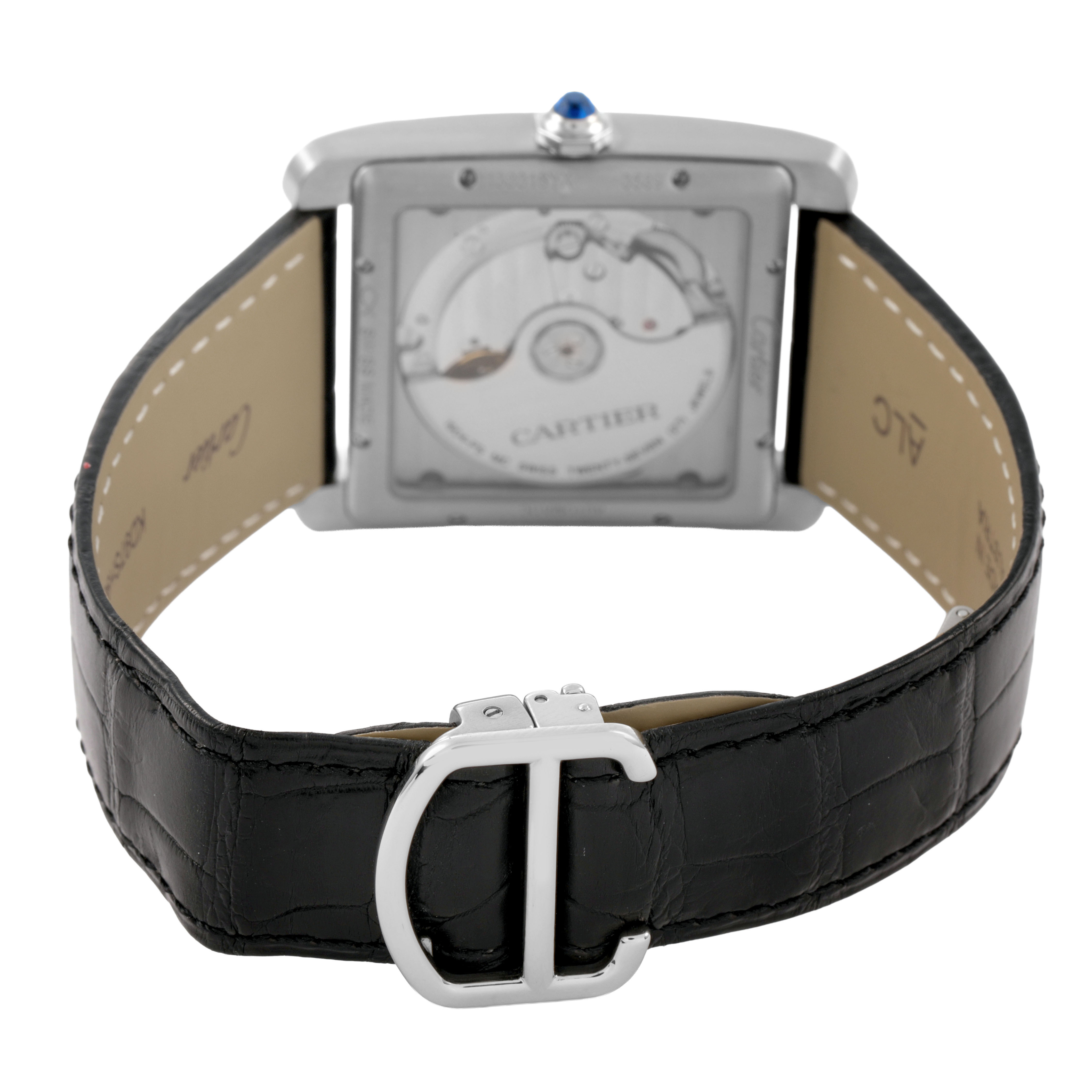 The image shows the back view of the Cartier Tank MC WSTA0010 Men's Stainless Steel Blue Dial watch, highlighting the case back, leather strap, and clasp.