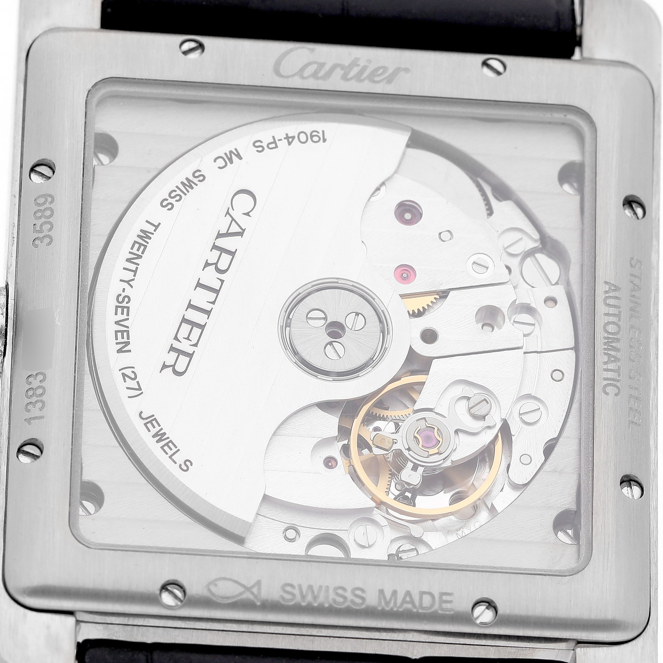 The Cartier Tank MC WSTA0010 Men's Stainless Steel Blue Dial watch is shown from the back, revealing its mechanical movement and intricate inner workings.