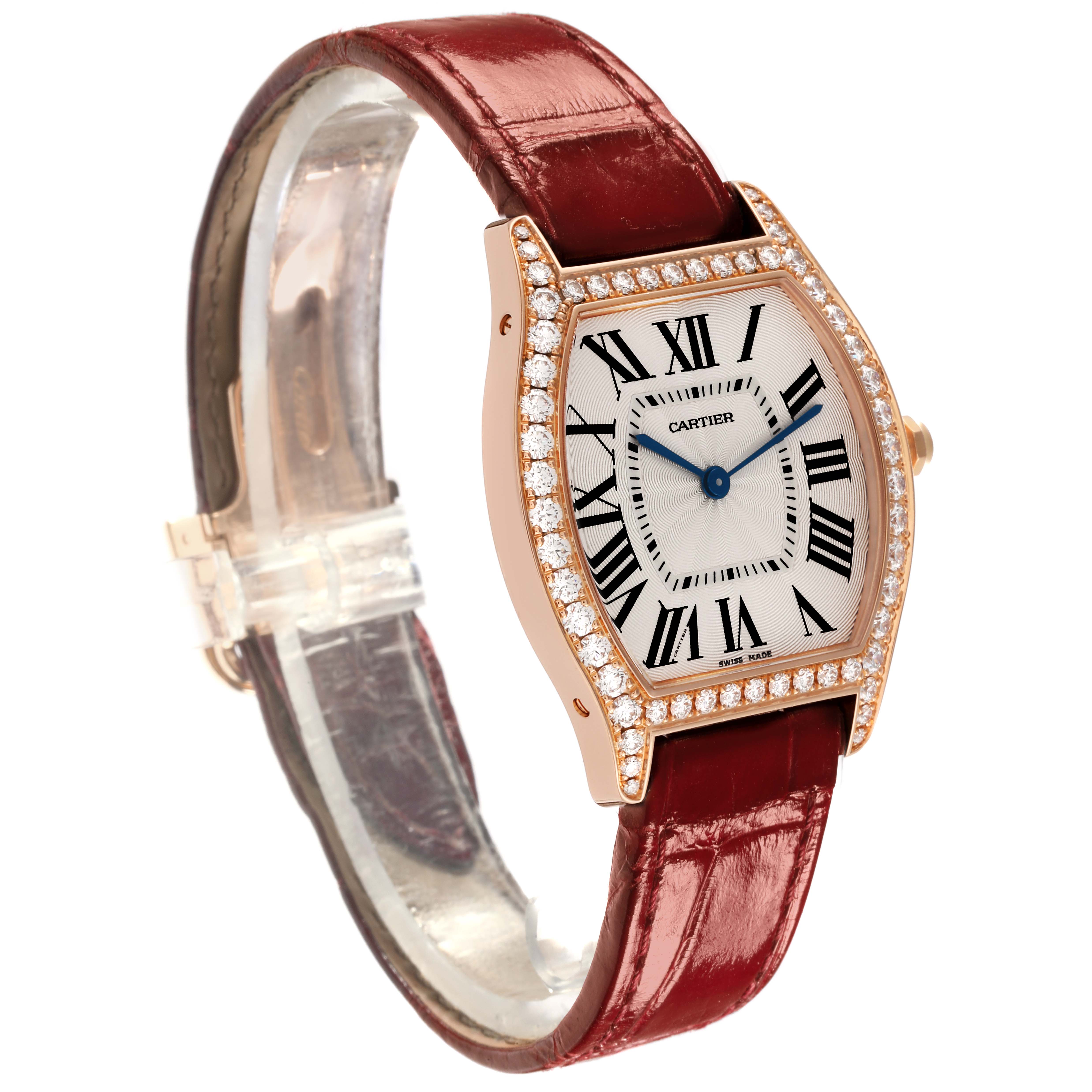 The Cartier Tortue WA501008 Women's Rose Gold Silver Dial WA501008 Women's Rose Gold Silver Dial watch is shown at an angle highlighting the face, diamond bezel, and brown leather strap.