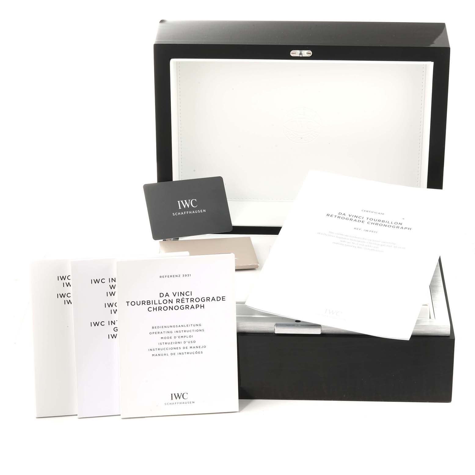 The image shows the packaging, warranty card, and instruction manuals for the IWC Da Vinci IW393101 Men's Rose Gold Silver Dial IW393101 Men's Rose Gold Silver Dial Tourbillon Retrograde Chronograph.