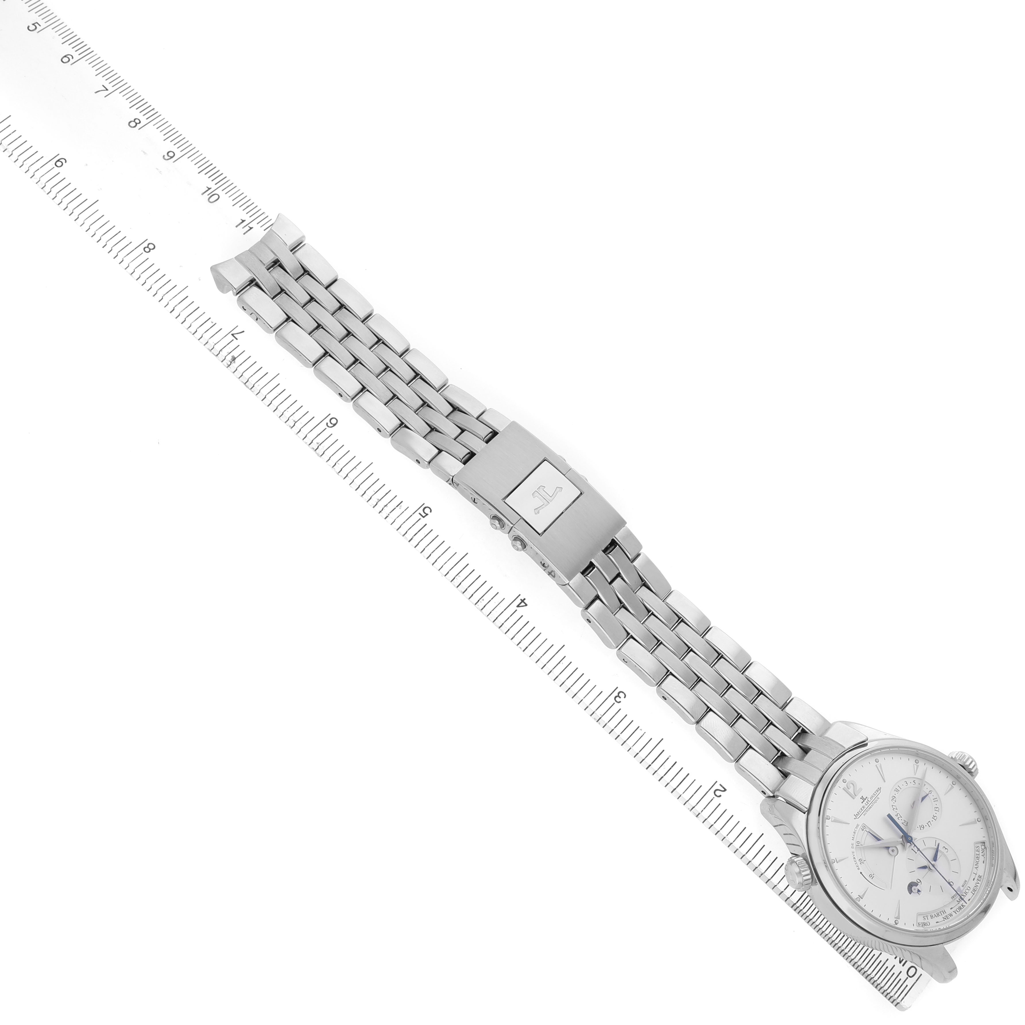 The Jaeger LeCoultre Master Q1428121 Men's Stainless Steel Silver Dial watch is shown at an oblique angle with a visible clasp, bracelet, and partial dial on a ruler.