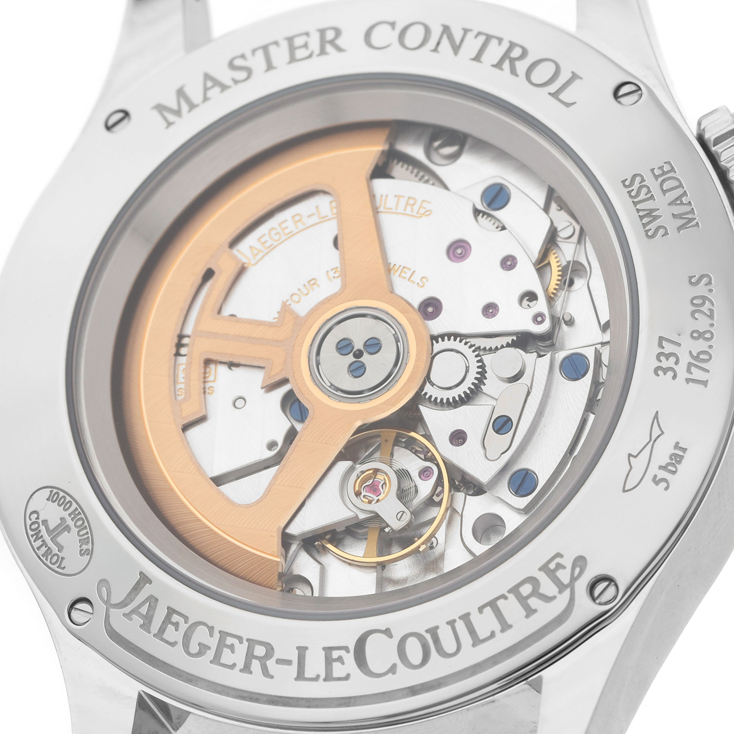 The image shows the back of the Jaeger-LeCoultre Master watch, highlighting its mechanical movement and rotor.