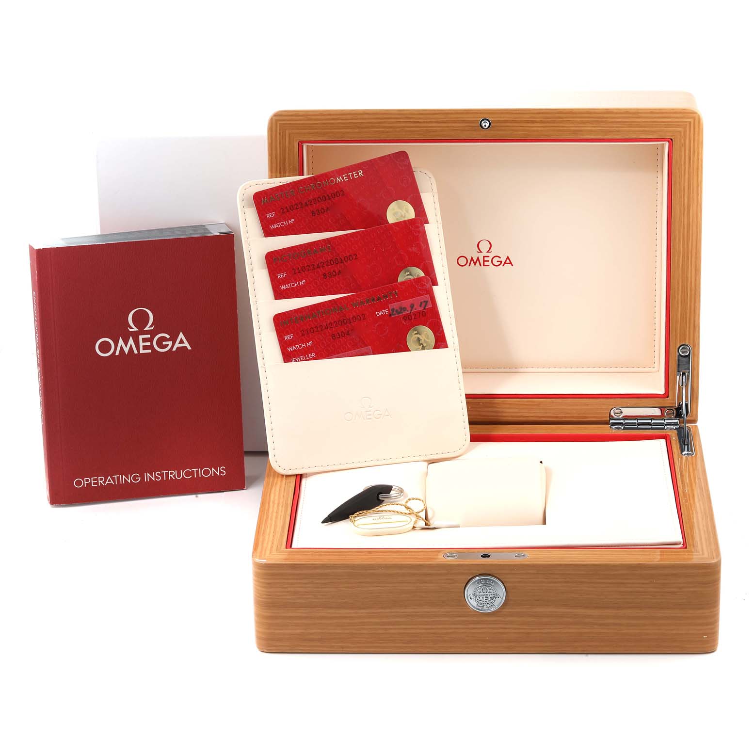 This image shows the accessories of an Omega Seamaster 210.22.42.20.01.002 Men's Steel and Gold (two tone) Black Dial 210.22.42.20.01.002 Men's Steel and Gold (two tone) Black Dial watch, including the box, operating instructions, cards, and cardholder.