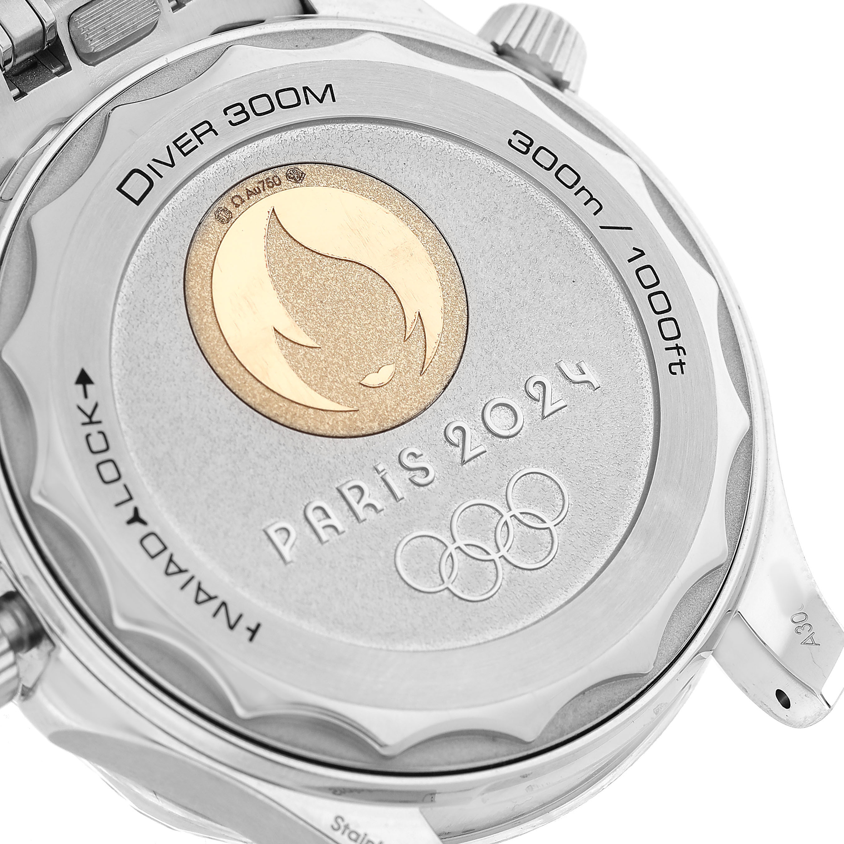 The image shows the case back of the Omega Seamaster 522.21.42.20.04.001 Men's Steel and Gold (two tone) White Dial, featuring engravings for "Paris 2024" and the Olympic rings.