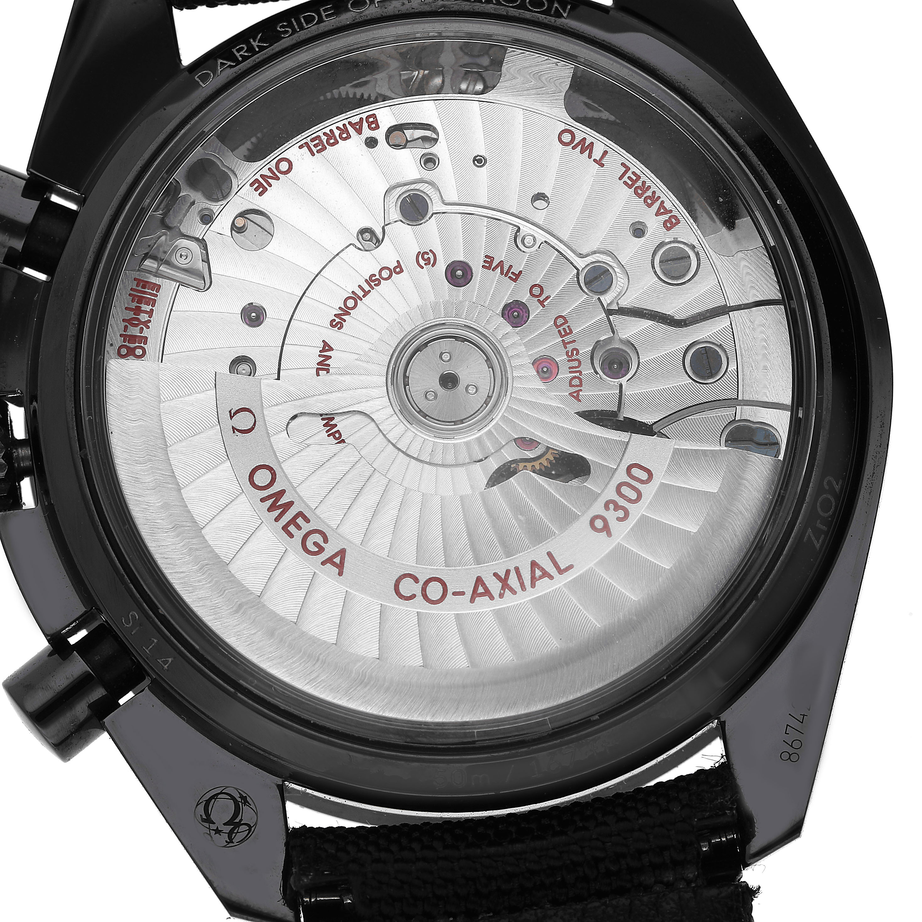 The image shows the back view of an Omega Speedmaster 311.92.44.51.01.007 Men's Ceramic Black Dial, highlighting its Co-Axial 9300 movement mechanism.