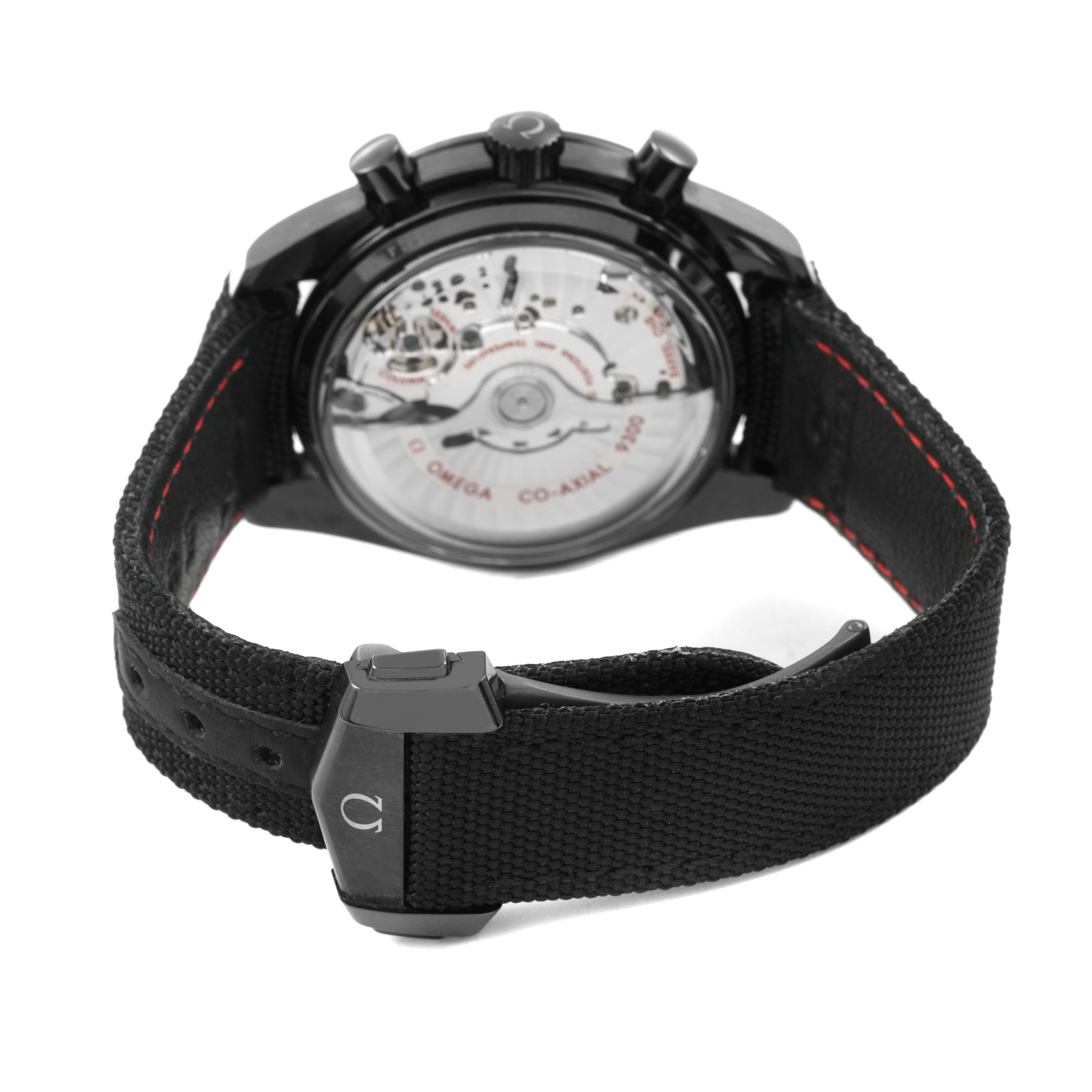 The Omega Speedmaster 311.92.44.51.01.007 Men's Ceramic Black Dial watch is shown from the back, highlighting the transparent case back and black strap with red stitching.