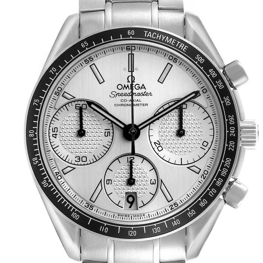 The Omega Speedmaster watch is shown from the front, highlighting the dial, tachymeter, and subdials.