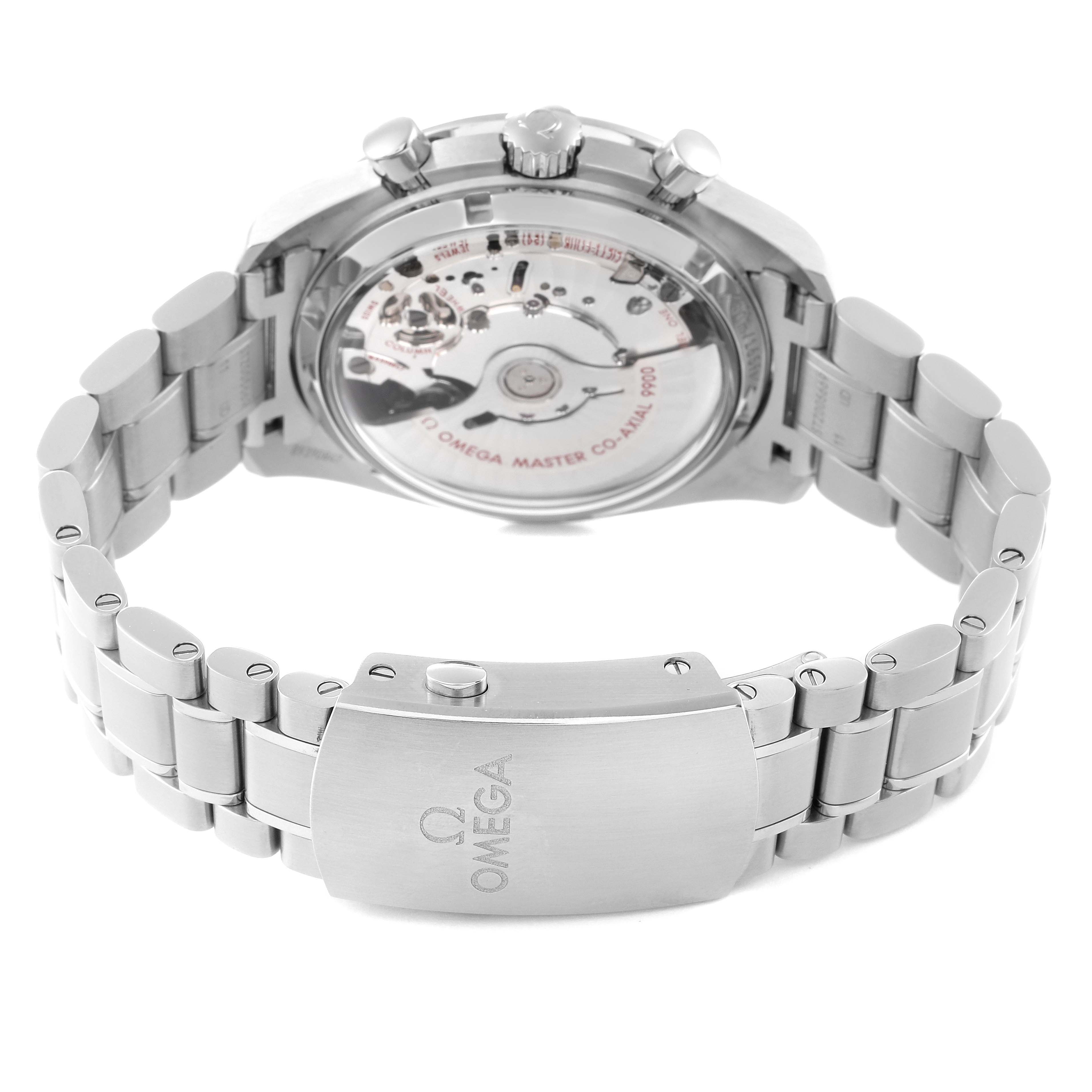 The image shows the back view of an Omega Speedmaster 329.30.44.51.04.001 Men's Stainless Steel Silver Dial, highlighting the transparent case back and metal bracelet clasp.