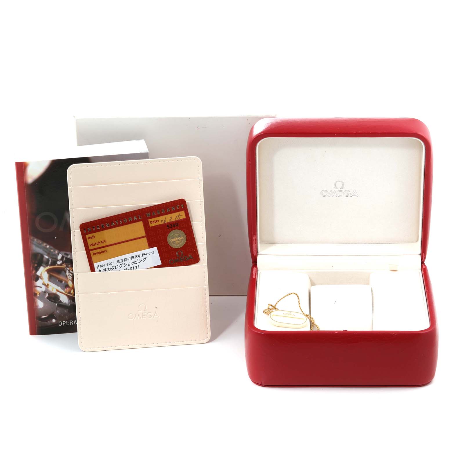 The image shows accessories for the Omega Speedmaster 3539.31.00 Men's Stainless Steel Silver Dial 3539.31.00 Men's Stainless Steel Silver Dial, including a red watch box, warranty card, manual, and cardholder.