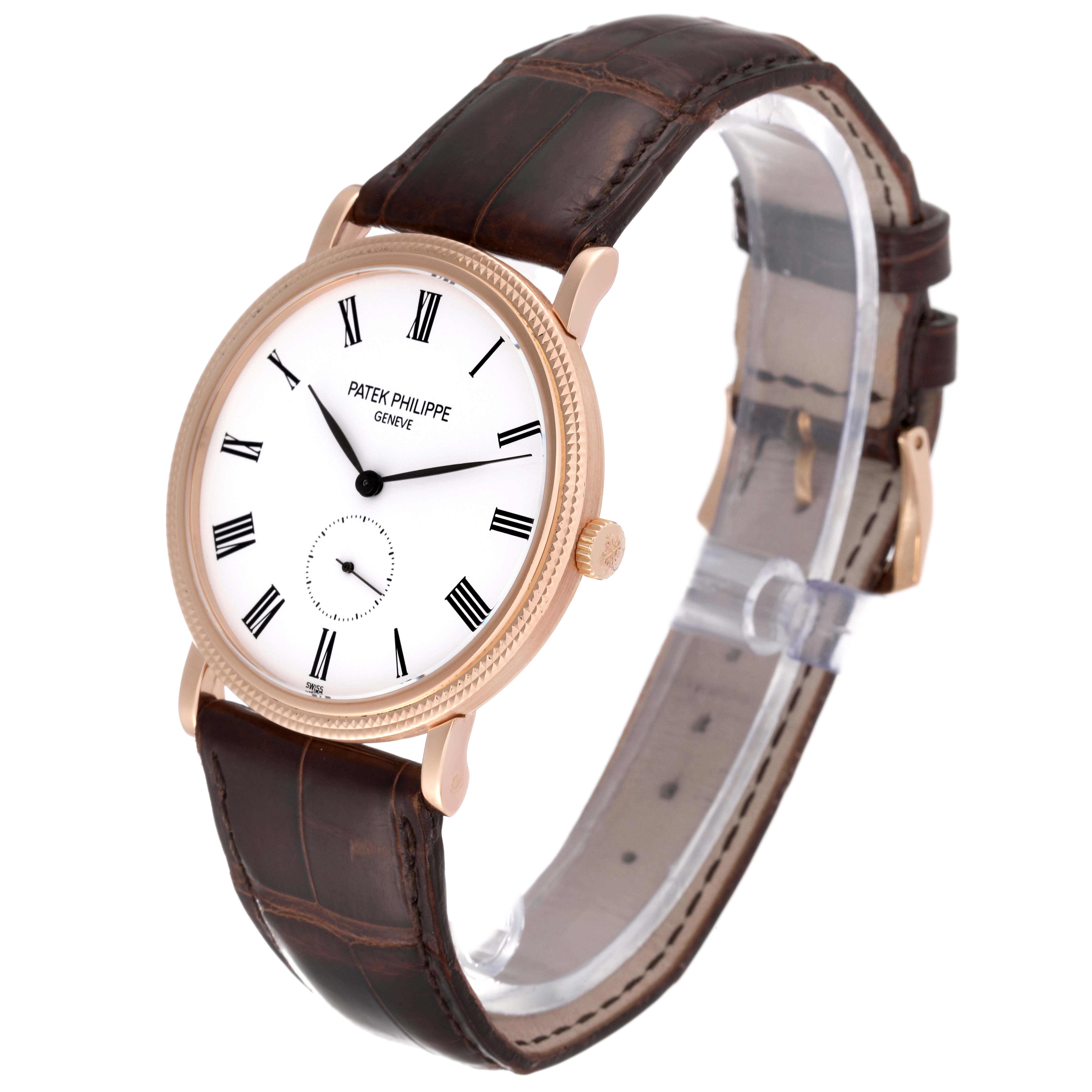 The image shows a Patek Philippe Calatrava 5119R Men
s Rose Gold White Dial 5119R Men
s Rose Gold White Dial watch at an oblique angle, highlighting the dial and brown leather strap.