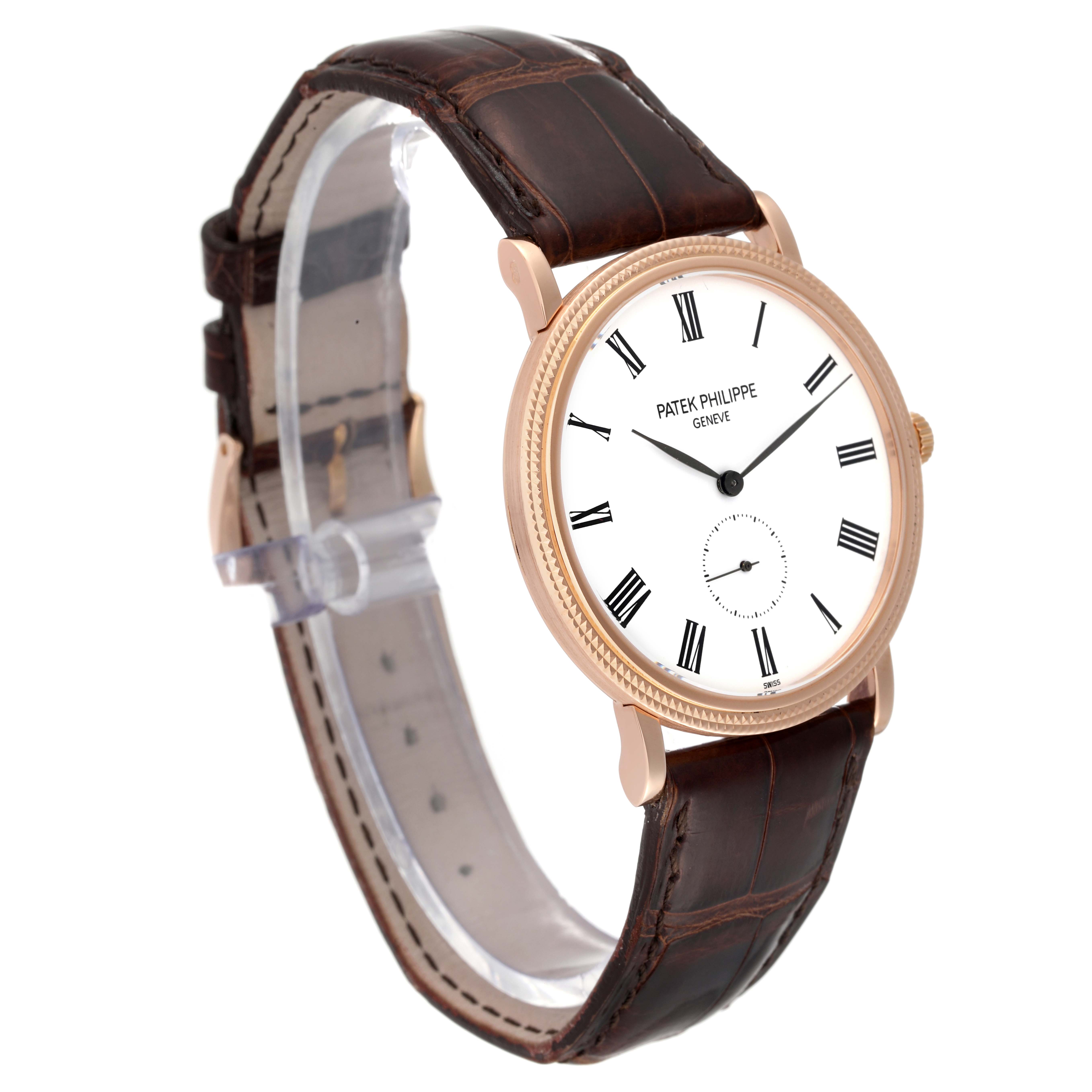 The image shows a side angle of a Patek Philippe Calatrava 5119R Men
s Rose Gold White Dial 5119R Men
s Rose Gold White Dial watch, highlighting its face, dial, and leather strap.
