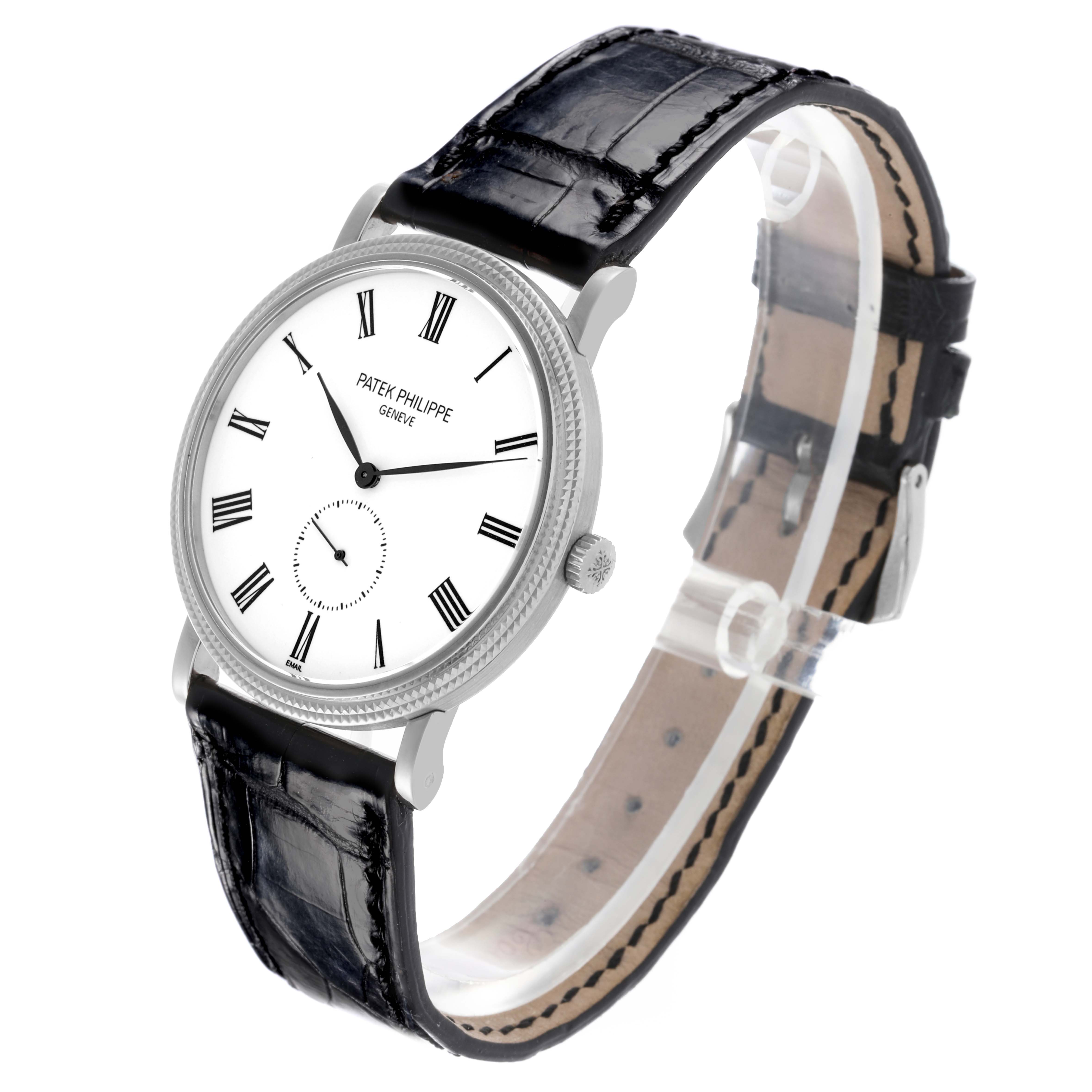 The image shows a side view of the Patek Philippe Calatrava 5116G Men
s White Gold White Dial 5116G Men
s White Gold White Dial displaying its face, crown, and leather strap.