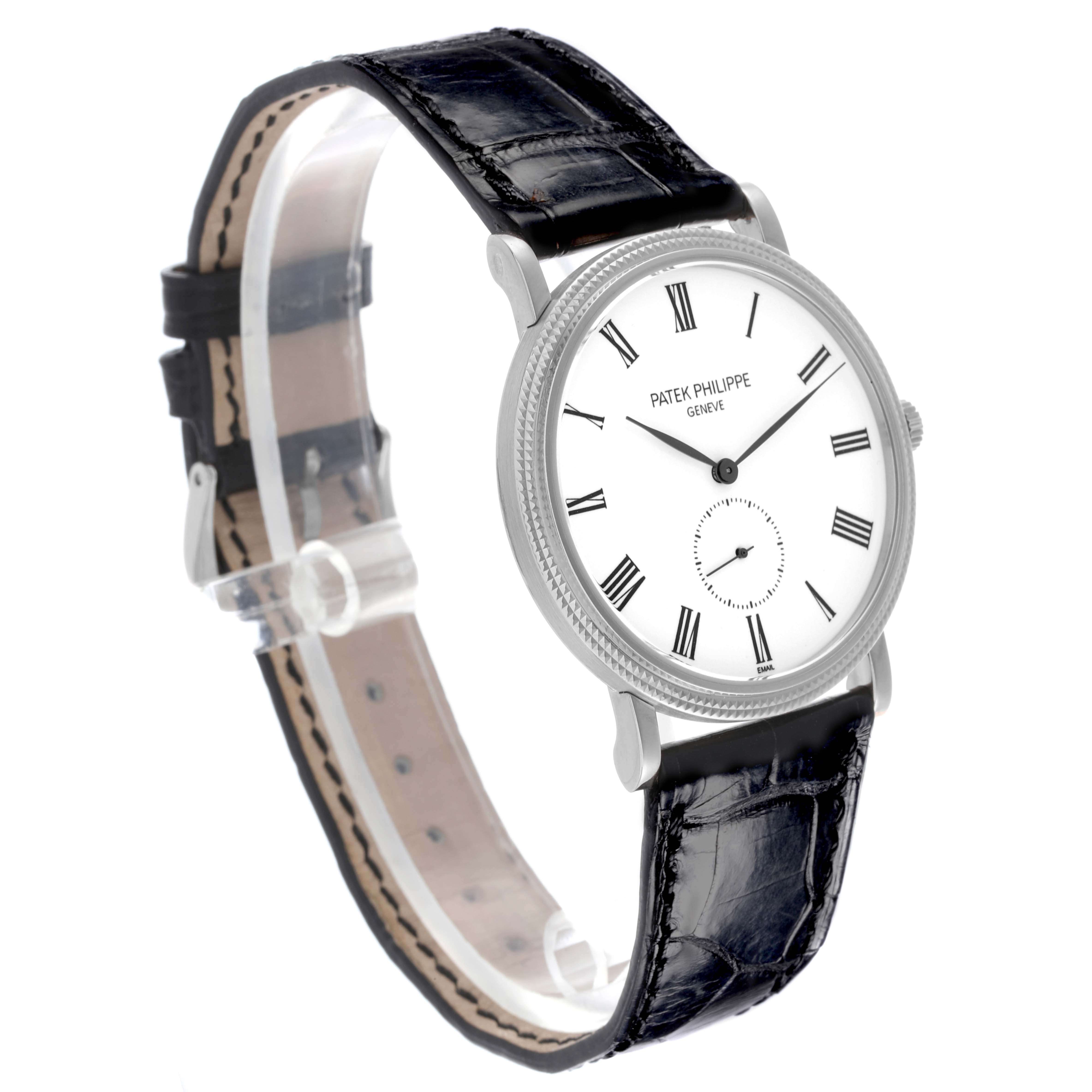 The Patek Philippe Calatrava 5116G Men
s White Gold White Dial 5116G Men
s White Gold White Dial watch is shown at a slight angle, displaying the face, Roman numerals, and leather strap.