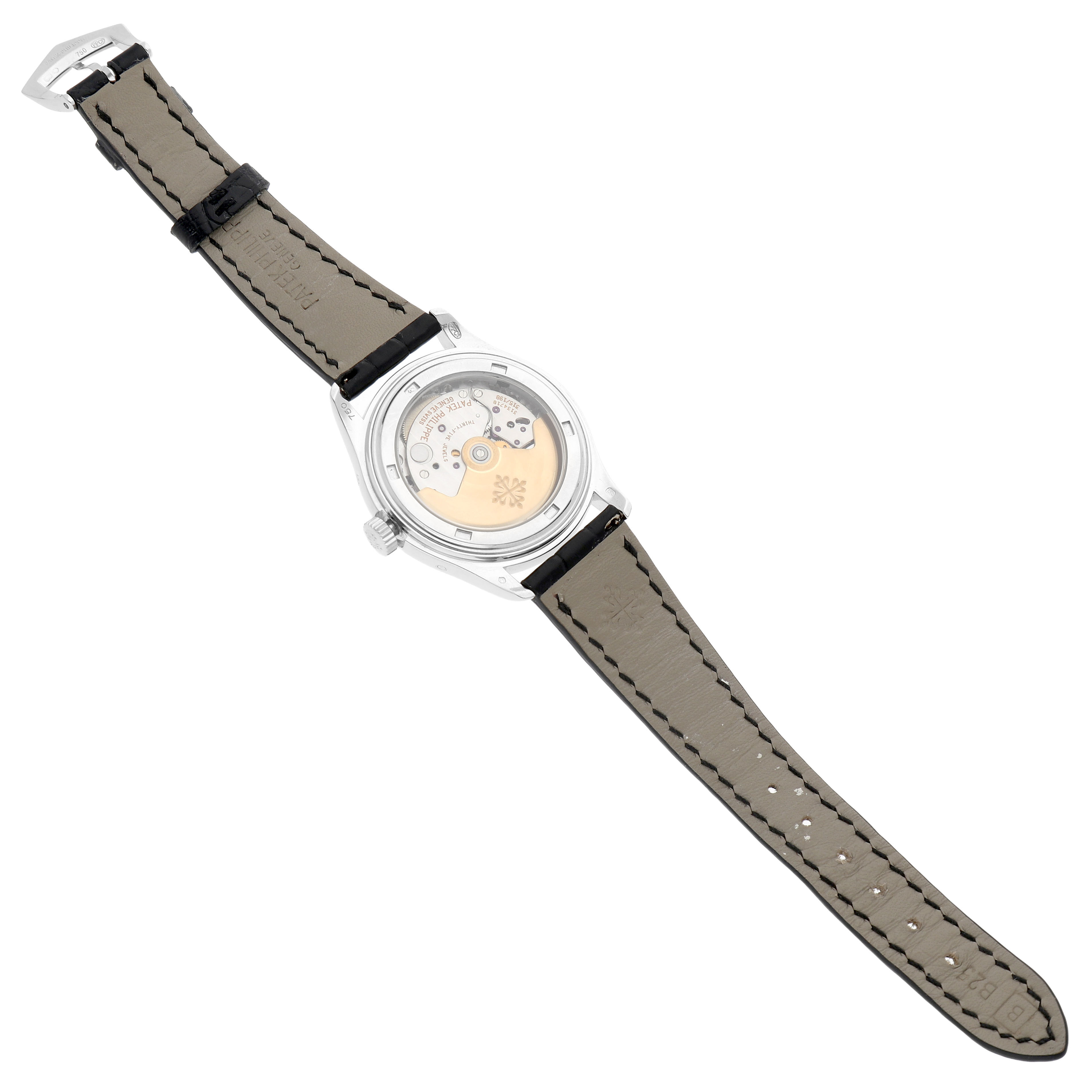 The image shows the back view of a Patek Philippe Complications 5035G-039 Men's White Gold Silver Dial watch, highlighting the movement and leather strap.