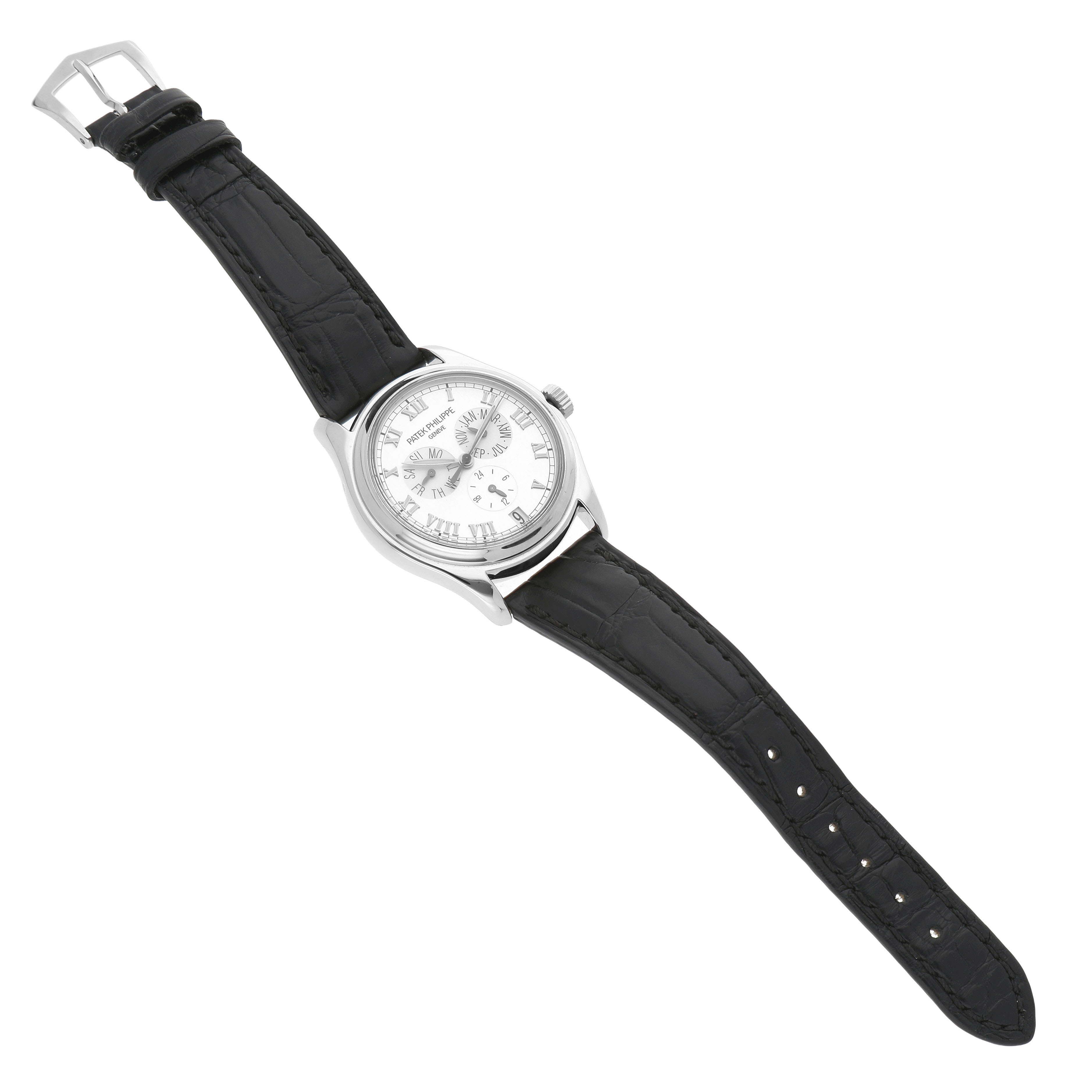 The Patek Philippe Complications 5035G-039 Men's White Gold Silver Dial watch is shown from a top-down angle, displaying the dial, case, bezel, crown, and full leather strap.