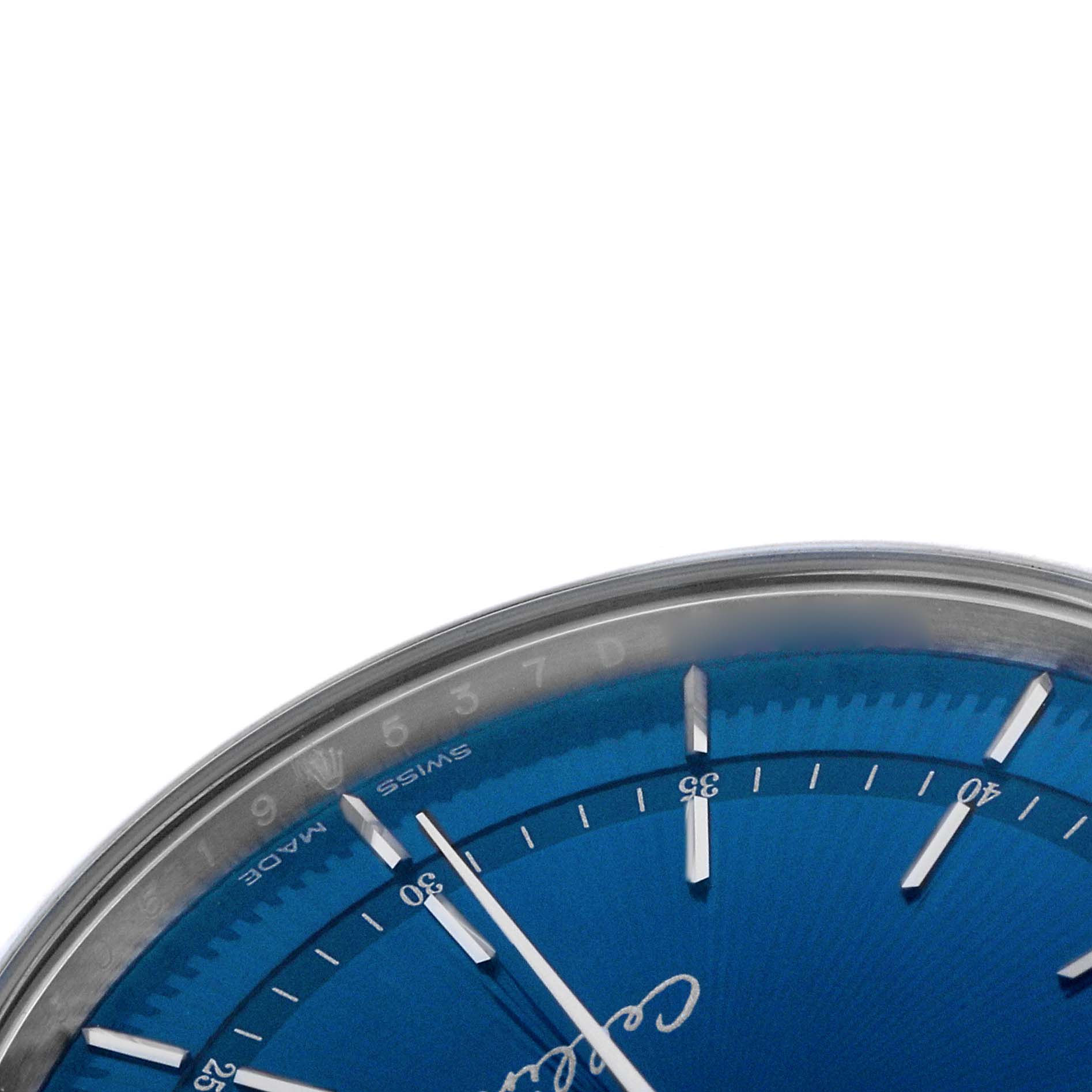 The image shows a close-up of the Rolex Cellini 50519 Men's White Gold Blue Dial watch, highlighting the blue dial and part of the bezel with minute markers.