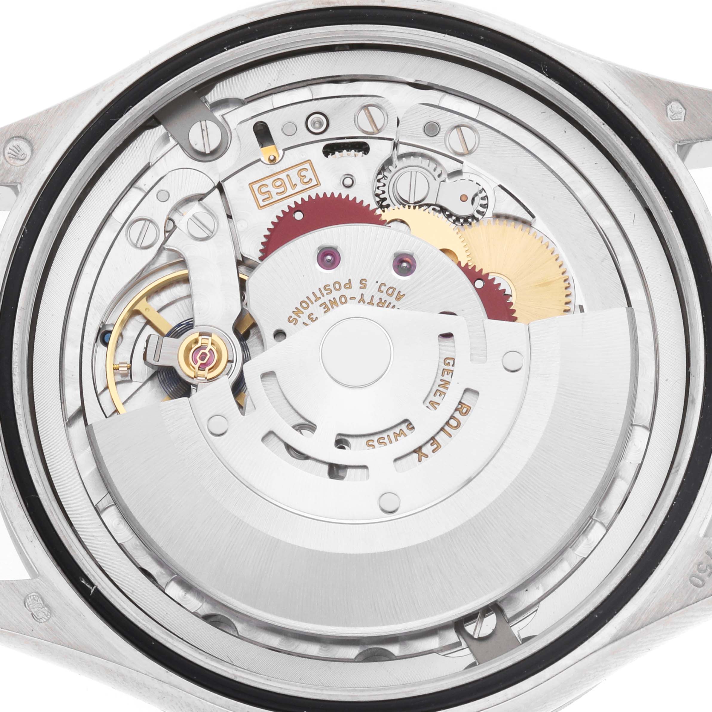 The image shows the movement of a Rolex Cellini 50519 Men's White Gold Blue Dial watch from a top-down angle, highlighting its mechanical components and gears.