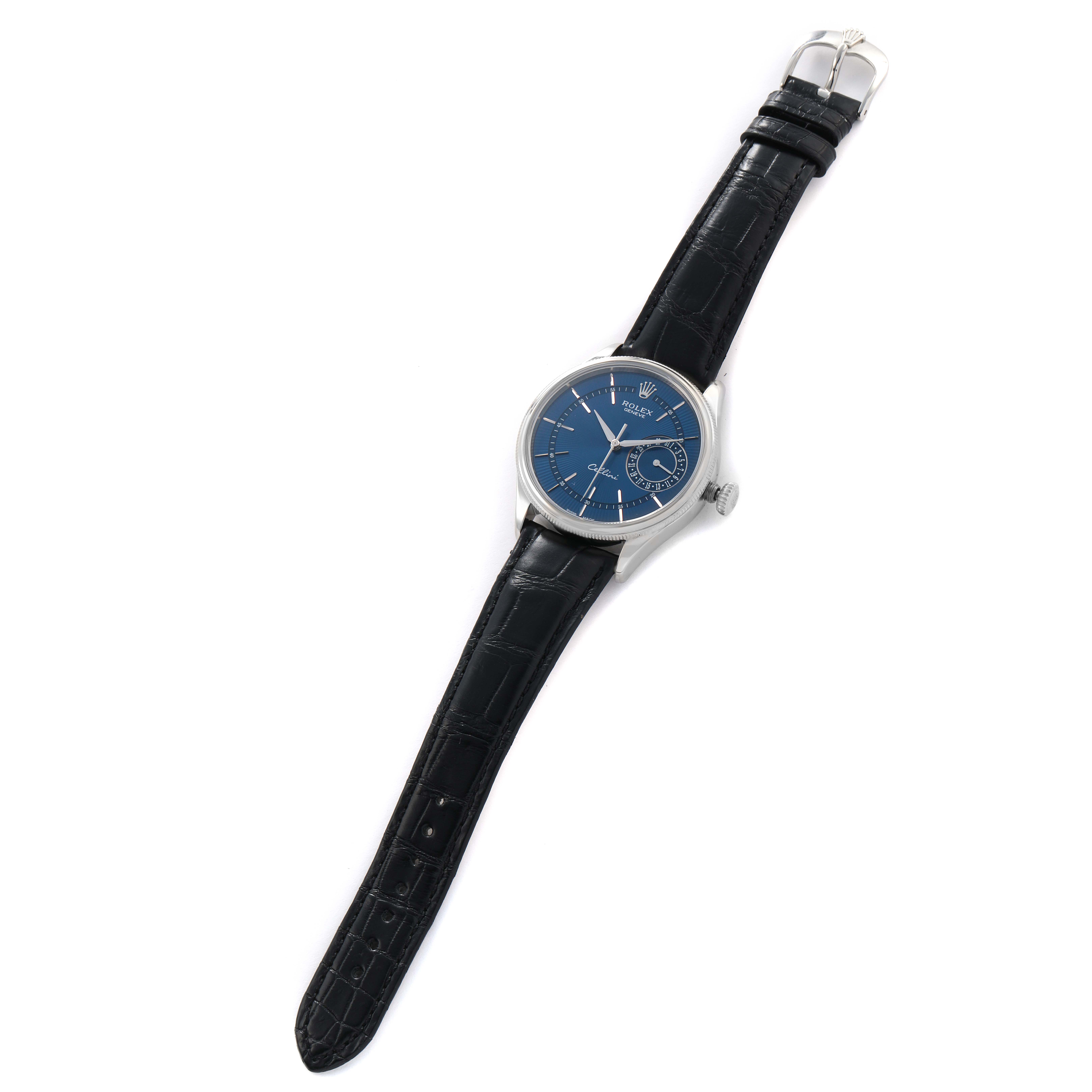 The Rolex Cellini 50519 Men's White Gold Blue Dial watch is shown from a diagonal top view, displaying its blue dial, black leather strap, and silver case.