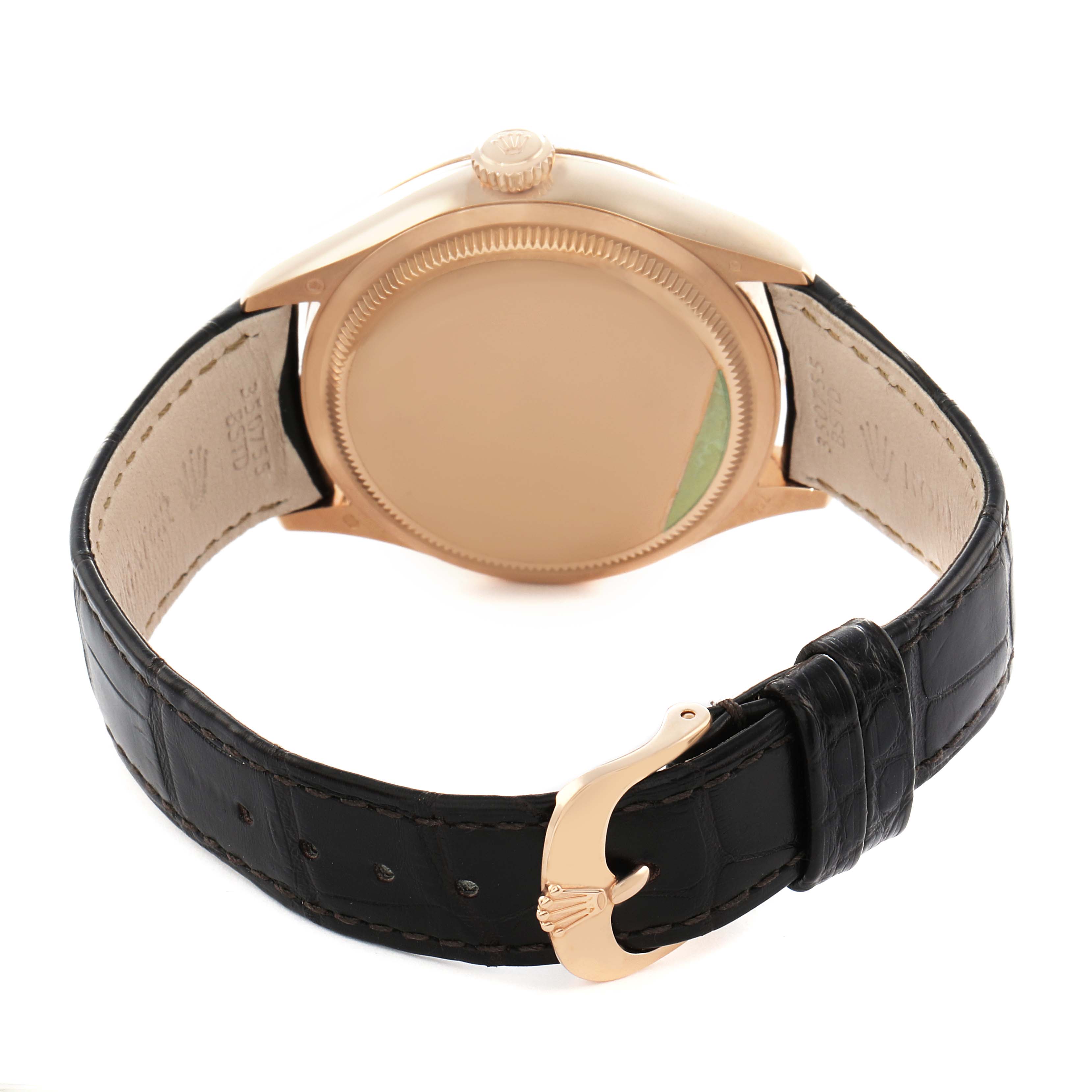 The image shows the back of a Rolex Cellini 50525 Men's Rose Gold Brown Dial watch with a visible case back, crown, and black leather strap with a gold buckle.