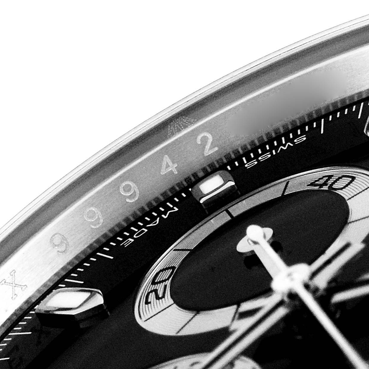This image shows a close-up of the dial and bezel of a Rolex Daytona 116500 Men's Stainless Steel Black Dial 116500 Men's Stainless Steel Black Dial watch, highlighting the tachymeter scale and sub-dials.