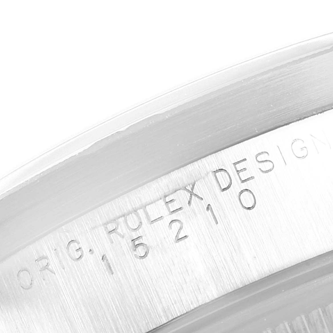 The image shows a close-up of the serial number engraving on the case of a Rolex Date 15210 Men's Stainless Steel Black Dial 15210 Men's Stainless Steel Black Dial model watch.