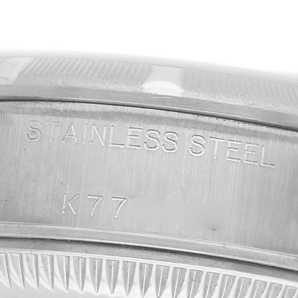 The image shows a close-up of the engraved stainless steel case back of a Rolex Date 79190 Women's Stainless Steel Pink Dial model watch.