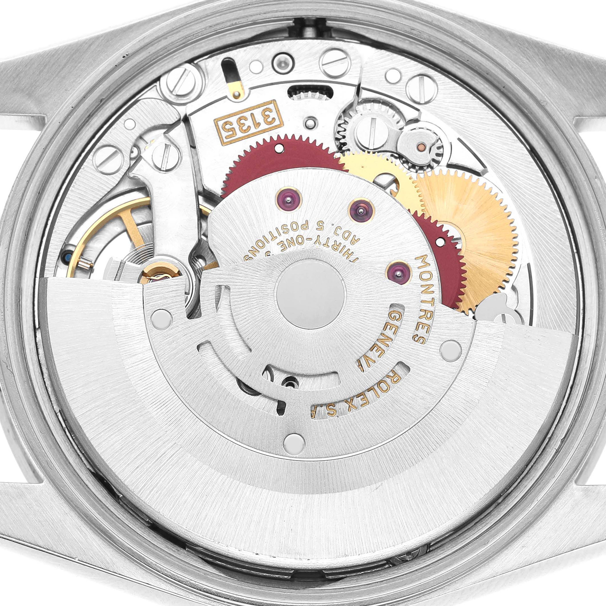The image shows the movement of a Rolex Date 15210 Men's Stainless Steel White Dial model watch from a back angle, revealing gears and inscriptions.