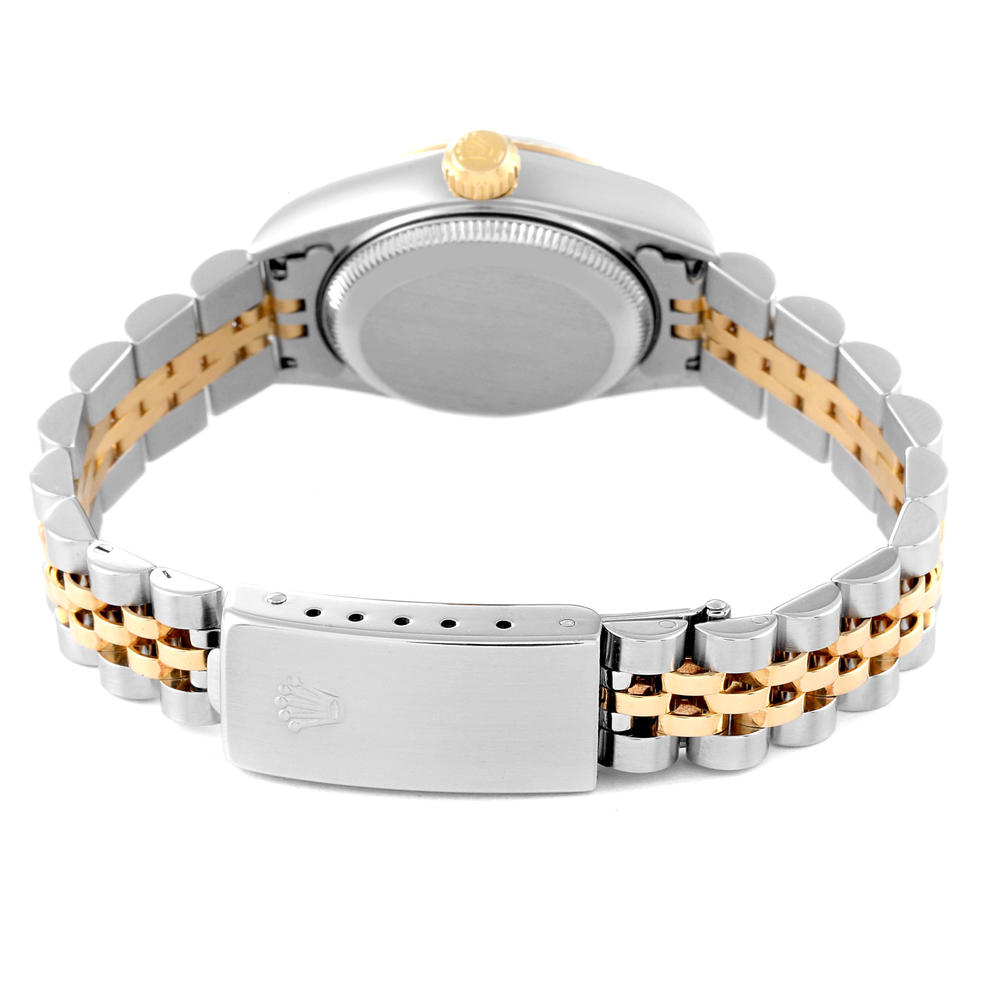 The Rolex Datejust 79173 Women's Stainless Steel Champagne Dial watch is shown from the back, highlighting the clasp, two-tone bracelet, case back, and crown.