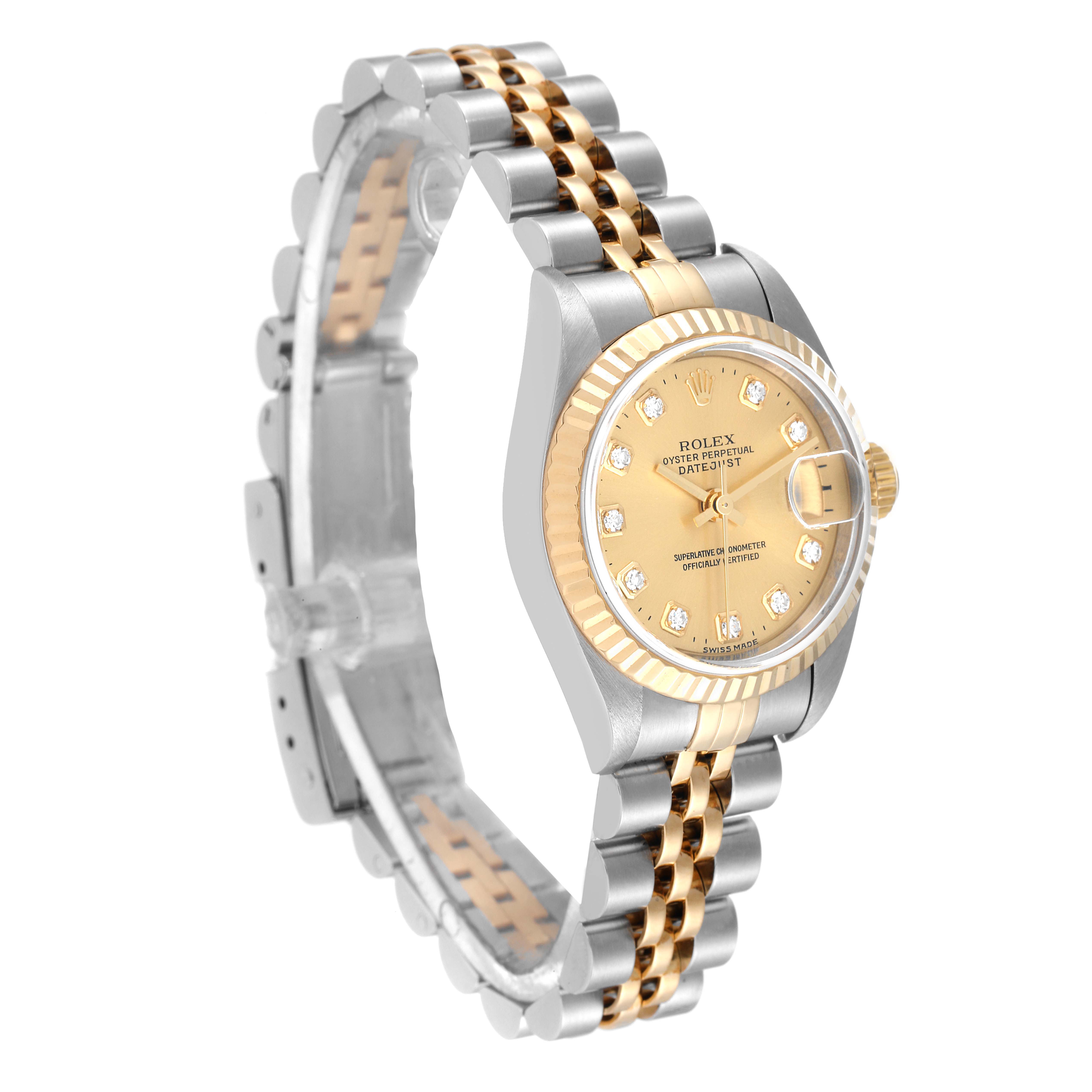 The image shows a Rolex Datejust 79173 Women's Stainless Steel Champagne Dial watch at a three-quarter angle, highlighting the gold dial, fluted bezel, and two-tone bracelet.