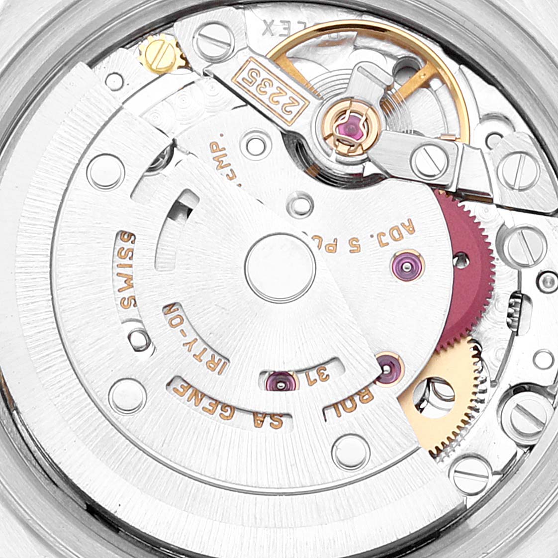 The image shows the Rolex Datejust 79173 Women's Stainless Steel Champagne Dial's movement from a top view, highlighting gears and engravings.