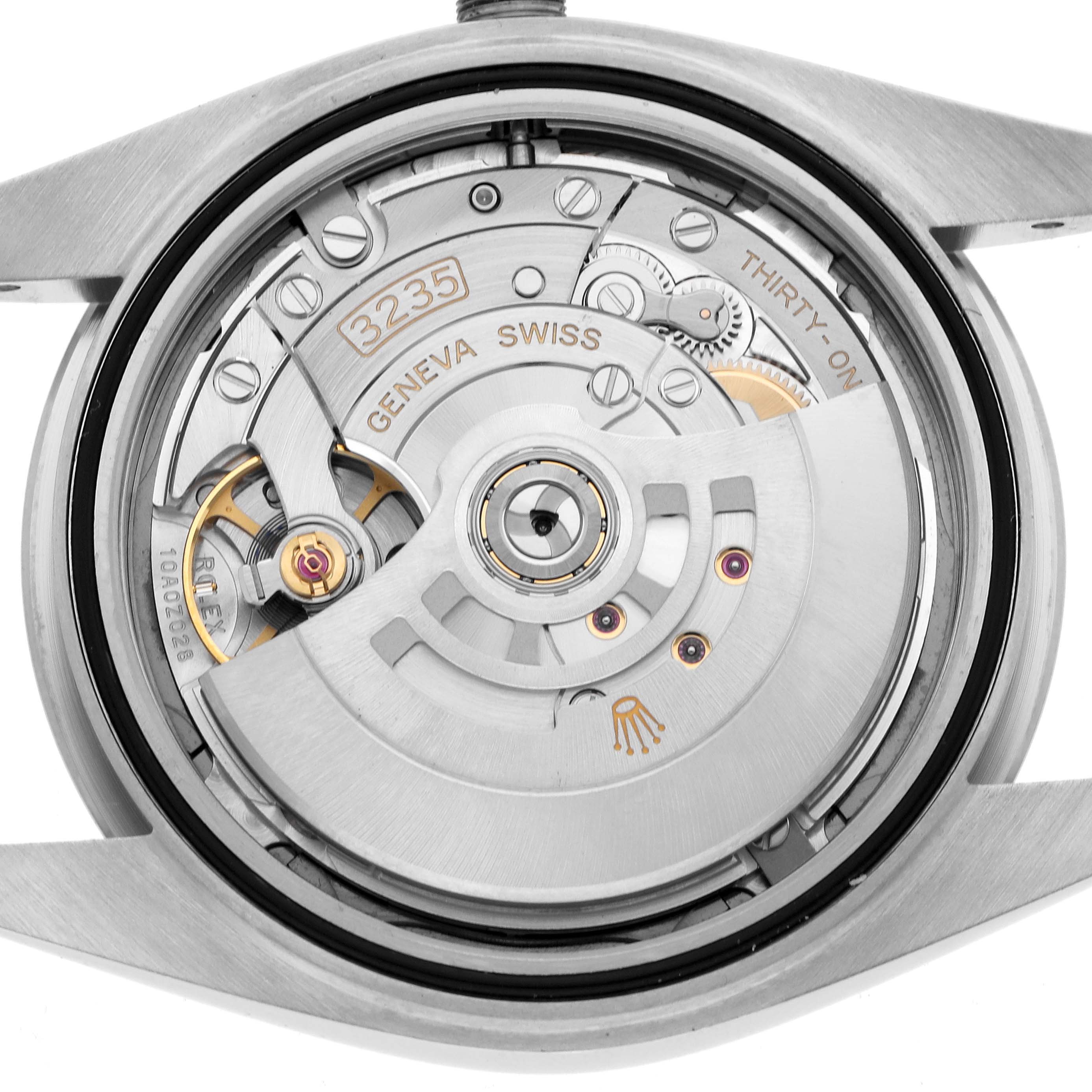 The image shows the back view of a Rolex Datejust 41 126334 Men's Stainless Steel Grey Dial, focusing on its intricate movement and rotor.