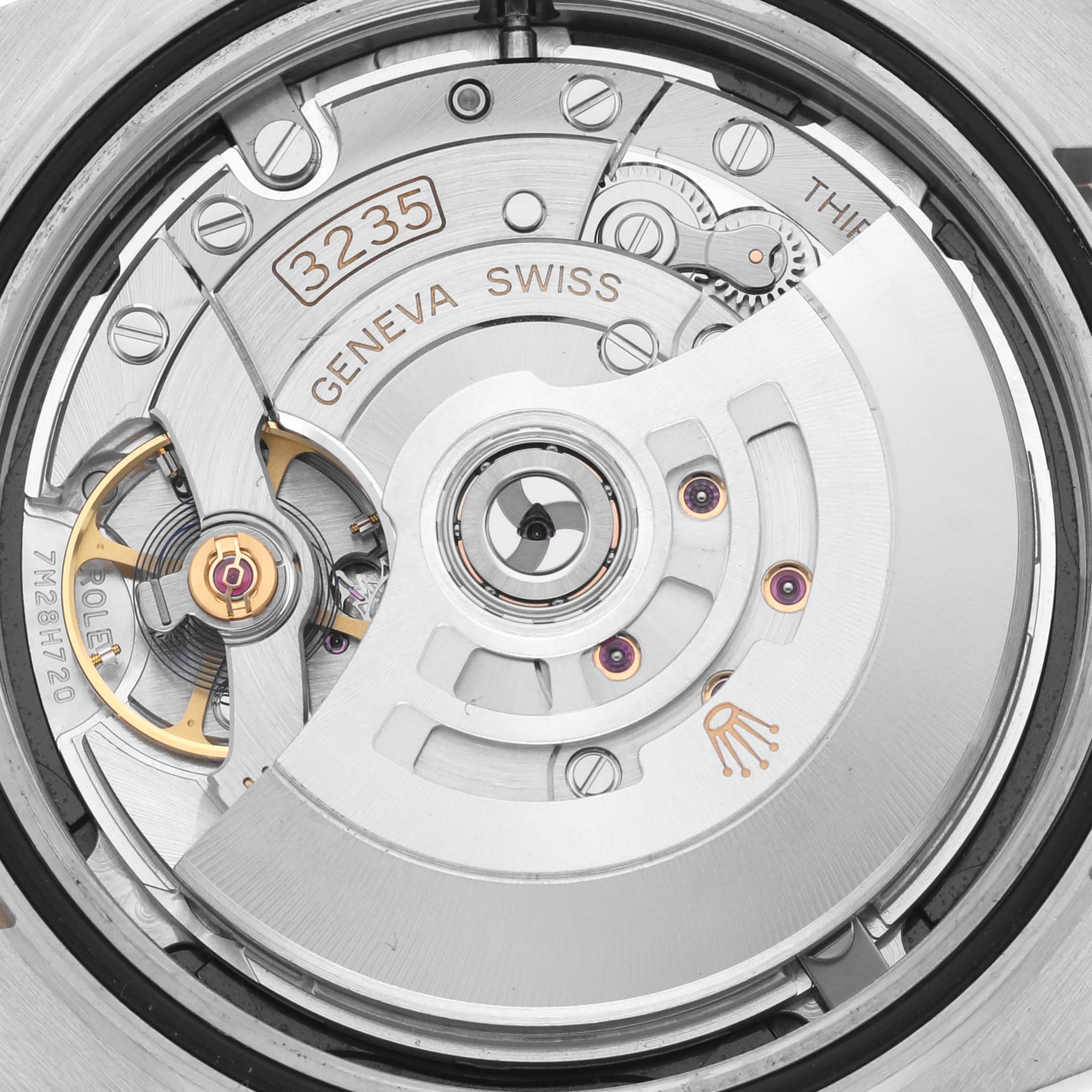 The image shows the movement of the Rolex Datejust 41 126333 Men
s Steel and Gold (two tone) Black Dial 126333 Men
s Steel and Gold (two tone) Black Dial, highlighting the intricate mechanics and rotor from the back.