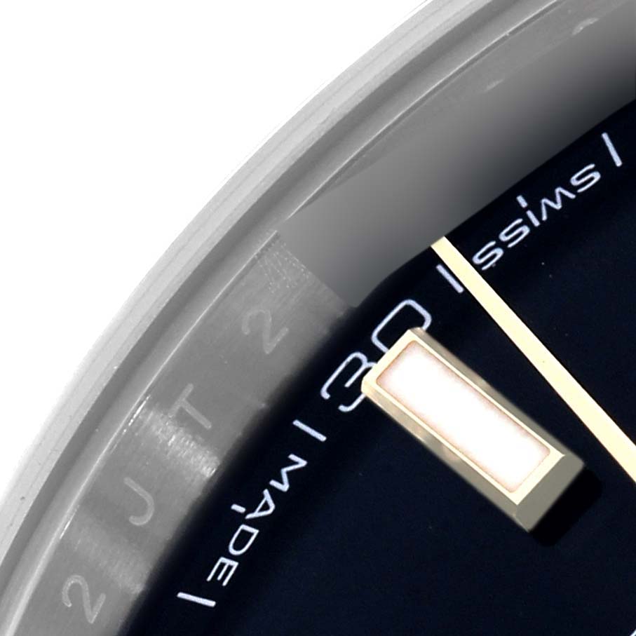 The image shows a close-up of the Rolex Datejust 41 126333 Men
s Steel and Gold (two tone) Black Dial 126333 Men
s Steel and Gold (two tone) Black Dial, highlighting part of the dial, bezel, and hour marker.