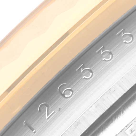 The image shows a close-up of the edge and numerals on the bezel of a Rolex Datejust 41 126333 Men
s Steel and Gold (two tone) Black Dial 126333 Men
s Steel and Gold (two tone) Black Dial watch.