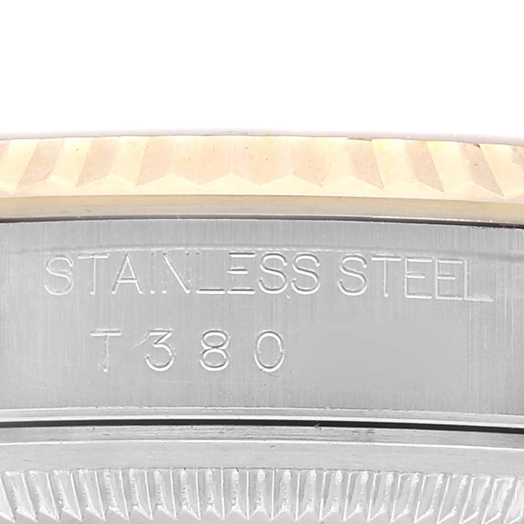 This image shows a close-up angle of the bezel and side case of a Rolex Datejust 16233 Men's Steel and Gold (two tone) Champagne Dial 16233 Men's Steel and Gold (two tone) Champagne Dial watch, highlighting the "STAINLESS STEEL" and model number engraving.