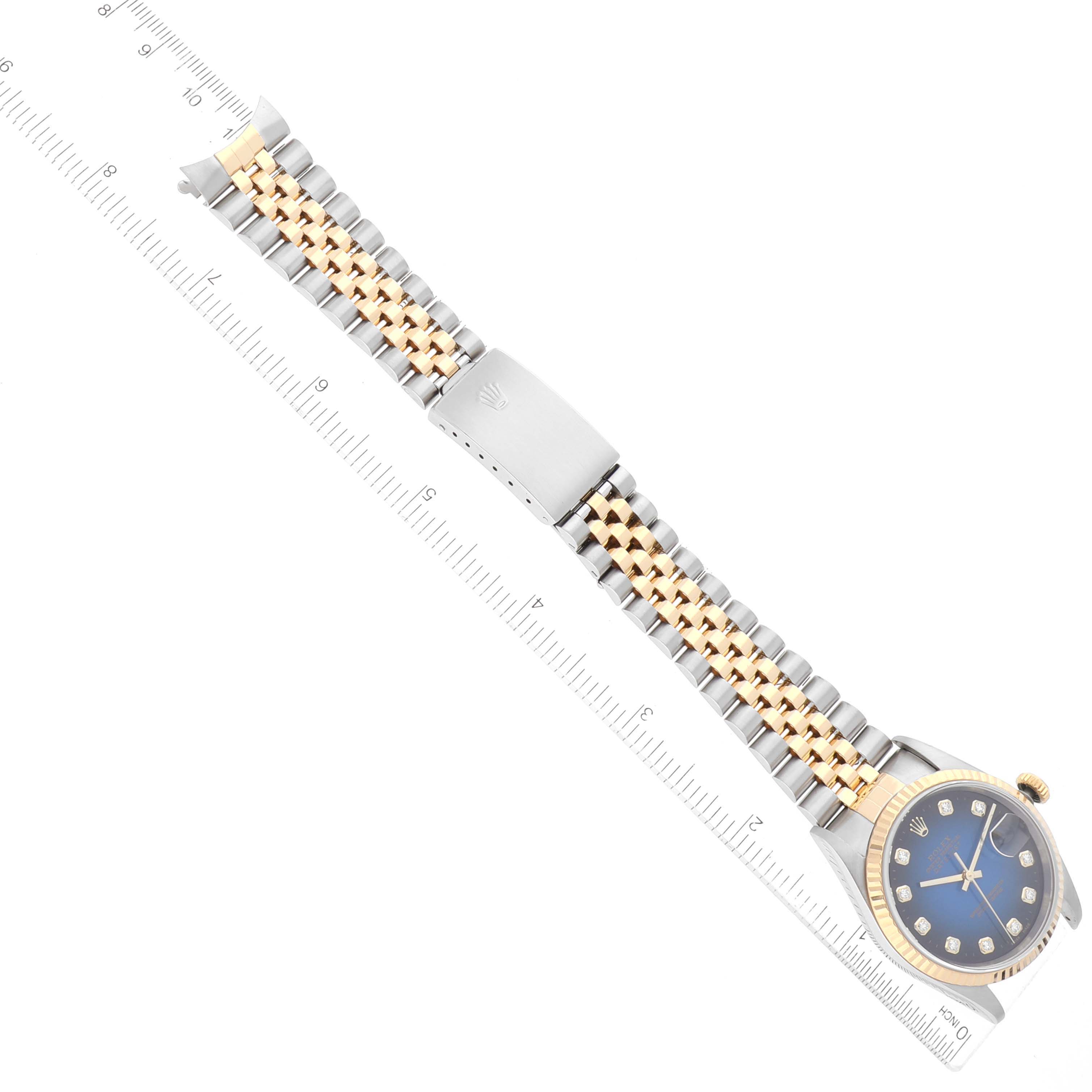 The image shows a Rolex Datejust 16233 Men's Stainless Steel Blue Dial 16233 Men's Stainless Steel Blue Dial watch laid flat, displaying the face, dial, and bracelet next to a ruler.