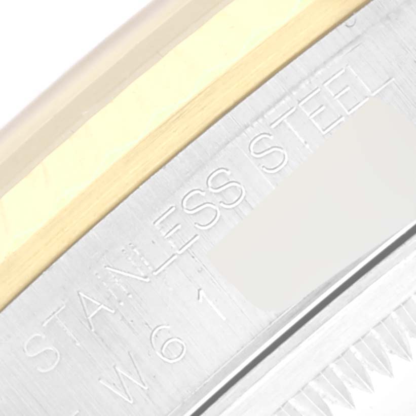 This close-up image shows the stainless steel part of the bezel and case of the Rolex Datejust 16233 Men's Stainless Steel Blue Dial 16233 Men's Stainless Steel Blue Dial watch.