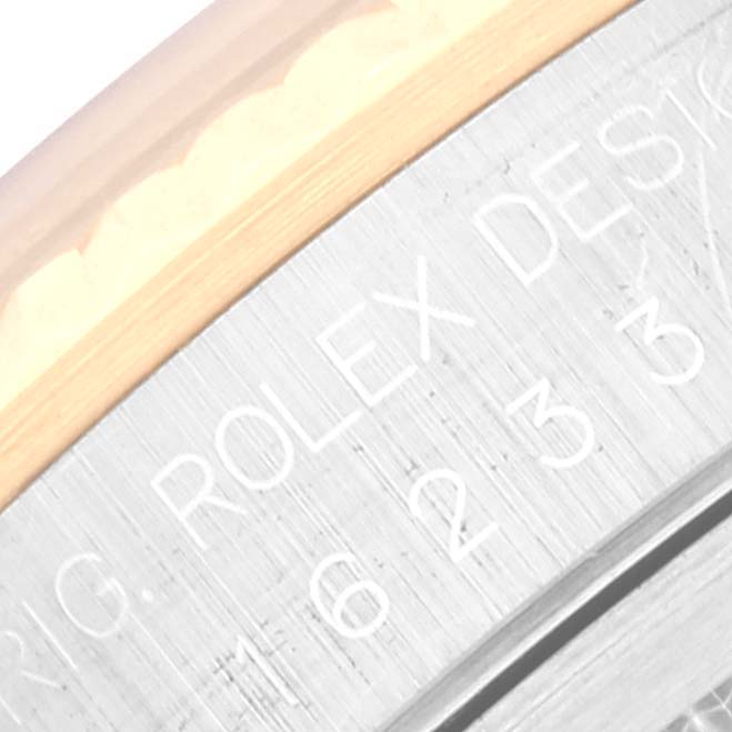 The image shows a close-up of the side engraving on a Rolex Datejust 16233 Men's Stainless Steel Blue Dial 16233 Men's Stainless Steel Blue Dial watch case.