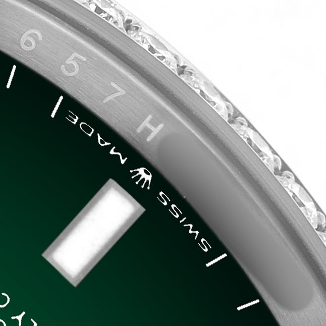 The image shows a close-up of the Rolex Datejust 126284RBR Men's Stainless Steel Green Dial's bezel, part of the dial, and a diamond detail.