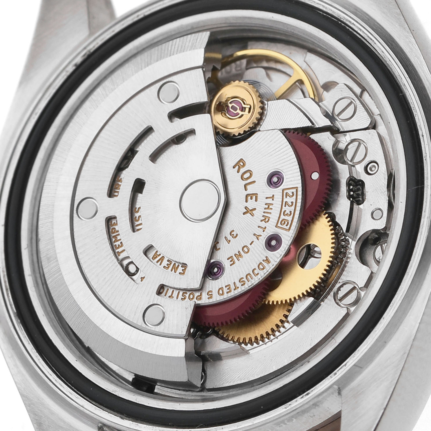 The image shows the movement mechanics of a Rolex Datejust 279171 Women's Steel and Gold (two tone) Brown Dial, showcasing gears and engravings from a back angle.