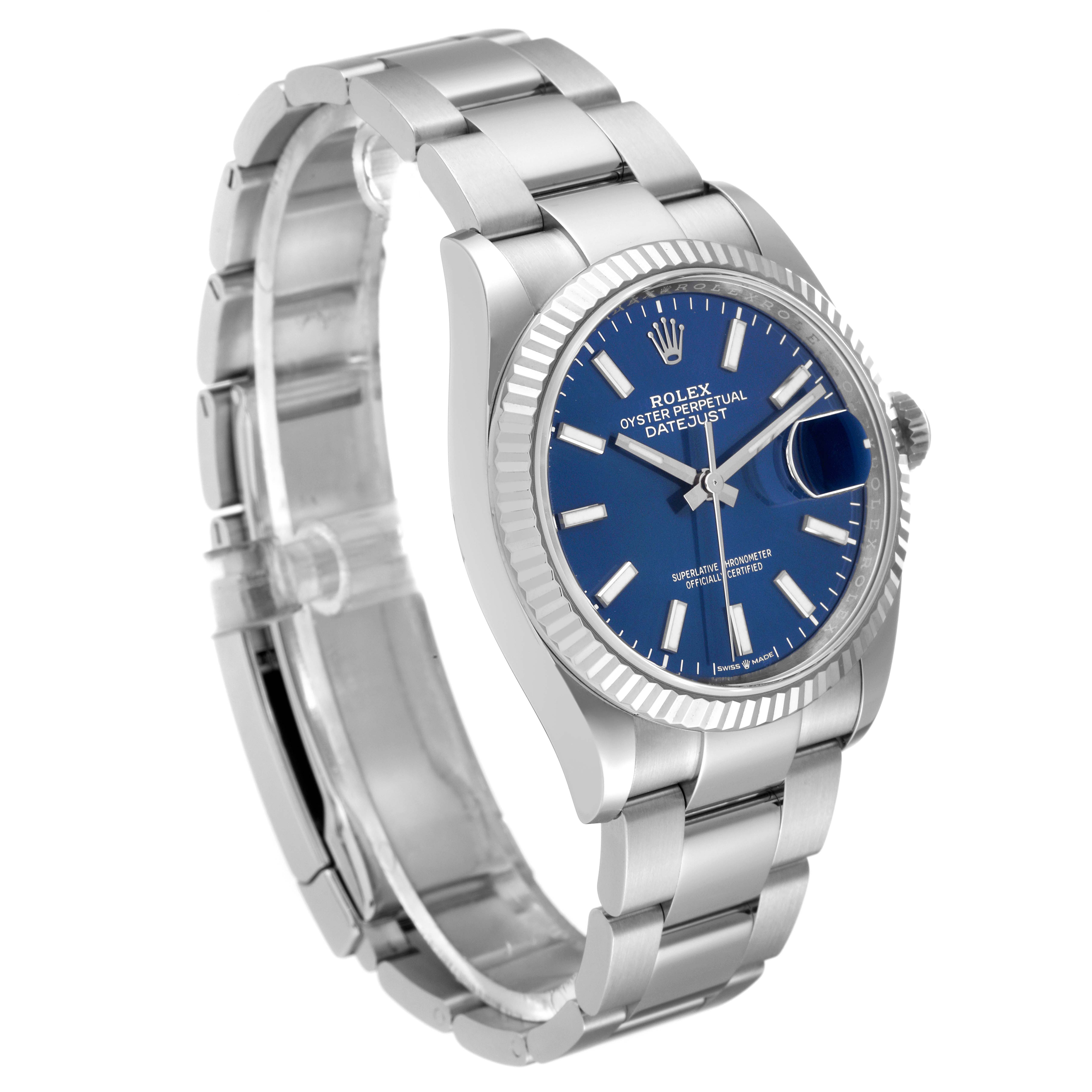 This Rolex Datejust 126234 Men
s Stainless Steel Blue Dial 126234 Men
s Stainless Steel Blue Dial is shown at an angle highlighting the watch face, bezel, crown, and bracelet.