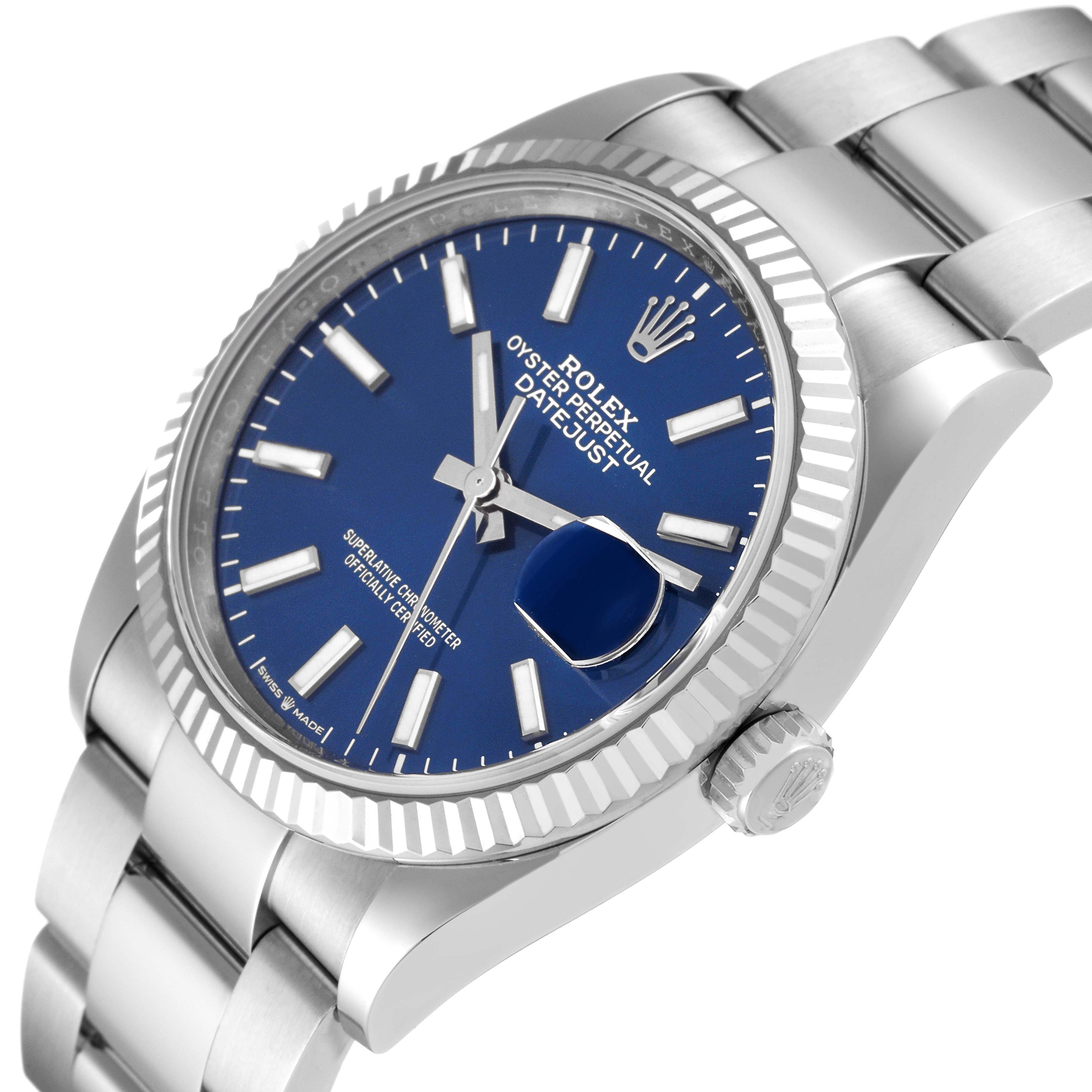 This image showcases a Rolex Datejust 126234 Men
s Stainless Steel Blue Dial 126234 Men
s Stainless Steel Blue Dial watch from an angled side view, highlighting its blue dial, fluted bezel, and metal bracelet.