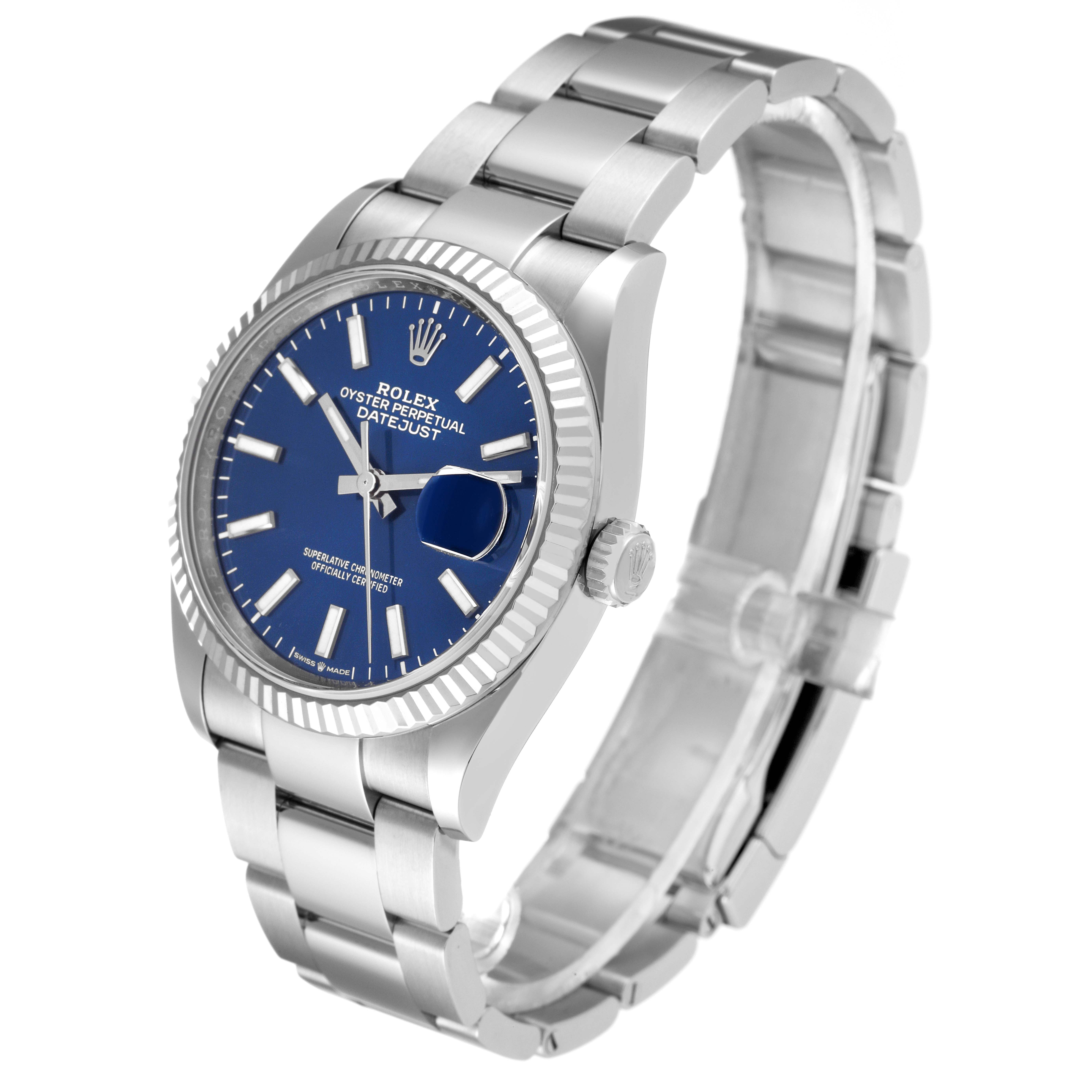 The image shows a Rolex Datejust 126234 Men
s Stainless Steel Blue Dial 126234 Men
s Stainless Steel Blue Dial watch at an angled view highlighting the bracelet, case, and blue dial.
