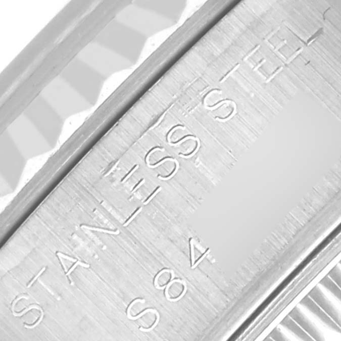 The image shows a close-up angle of the inner bezel, with engravings of "STAINLESS STEEL" on the Rolex Datejust 69174 Women's Stainless Steel Blue Dial 69174 Women's Stainless Steel Blue Dial model.