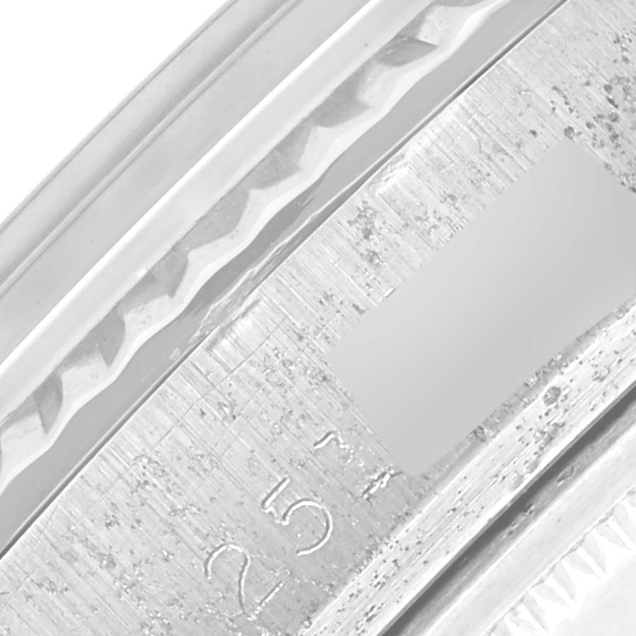 This image shows a close-up view of the side engraving on a Rolex Vintage Collection 1601 Men's Stainless Steel Silver Dial 1601 Men's Stainless Steel Silver Dial model.