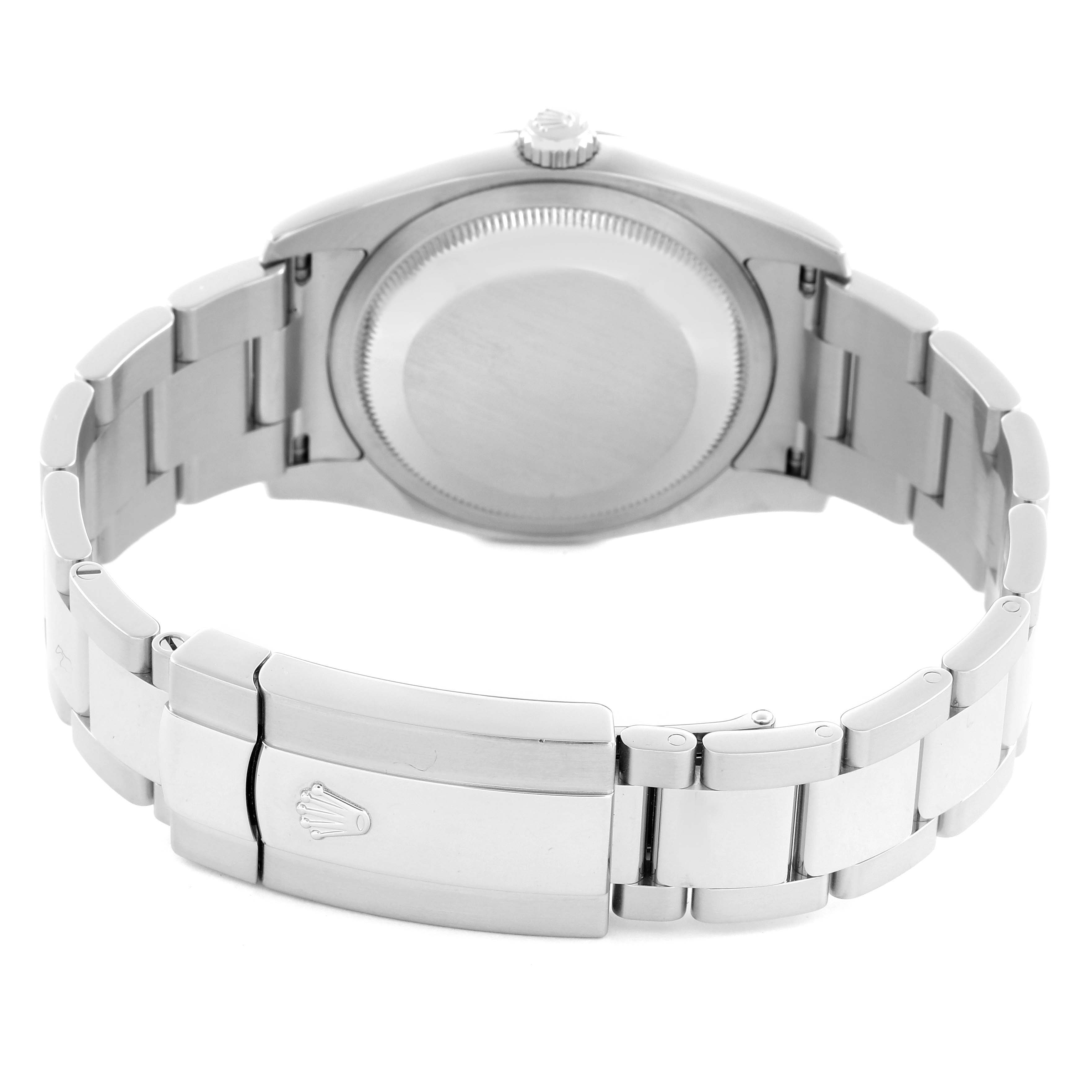 The Rolex Datejust 116234 Men
s Stainless Steel Black Dial 116234 Men
s Stainless Steel Black Dial watch is shown from the back, highlighting the case, crown, and stainless steel bracelet clasp.