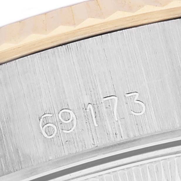 This image shows a close-up of the case side of a Rolex Datejust 69173 Women's Stainless Steel Champagne Dial 69173 Women's Stainless Steel Champagne Dial, with model number 69173 engraved.