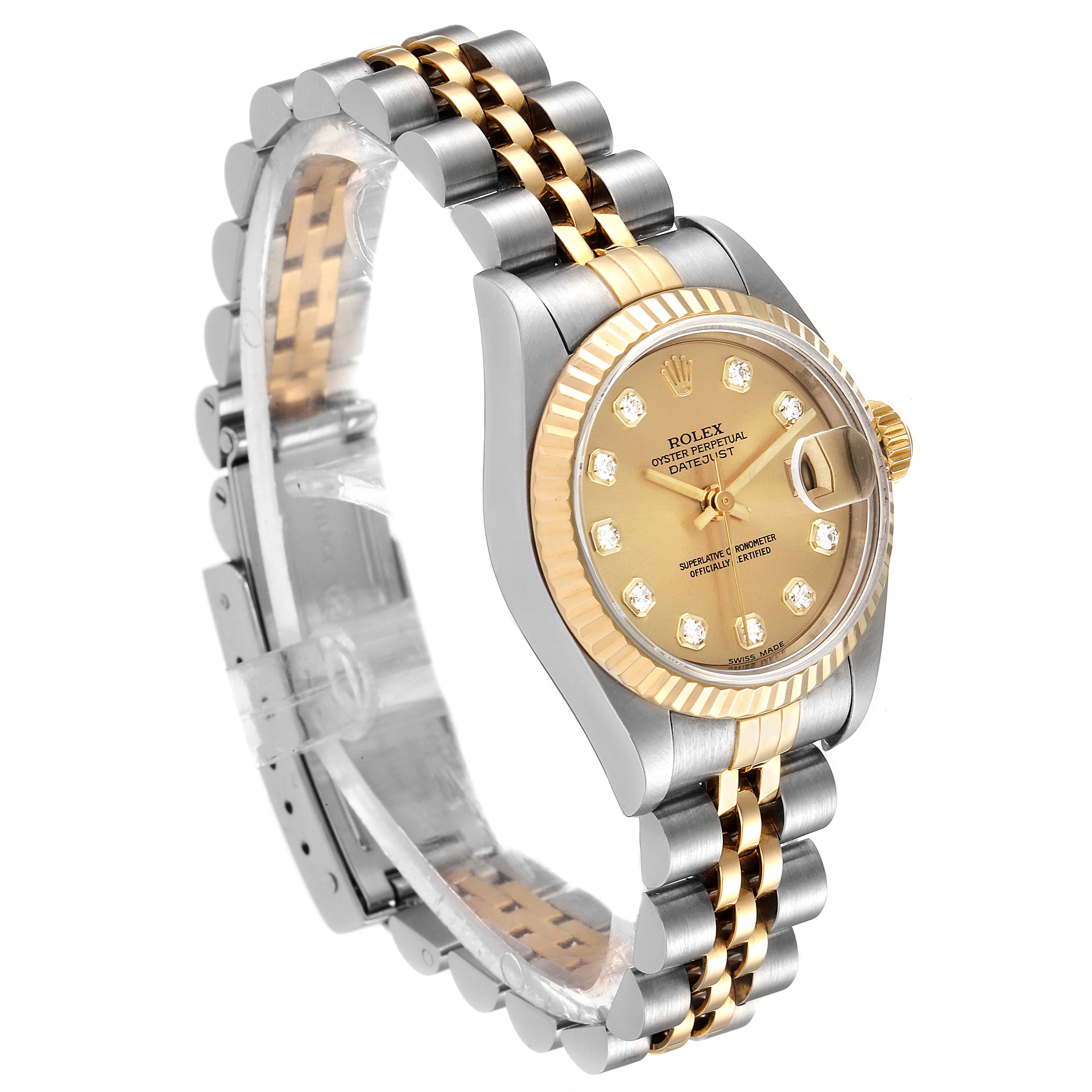 The image shows the Rolex Datejust 79173 Women's Steel and Gold (two tone) Champagne Dial 79173 Women's Steel and Gold (two tone) Champagne Dial watch at an oblique angle, highlighting its two-tone bracelet, bezel, and dial with diamond hour markers.