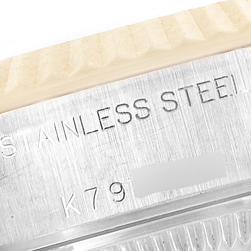 The image shows a close-up of the stainless steel casing and part of the bezel of a Rolex Datejust 79173 Women's Steel and Gold (two tone) Champagne Dial 79173 Women's Steel and Gold (two tone) Champagne Dial watch.