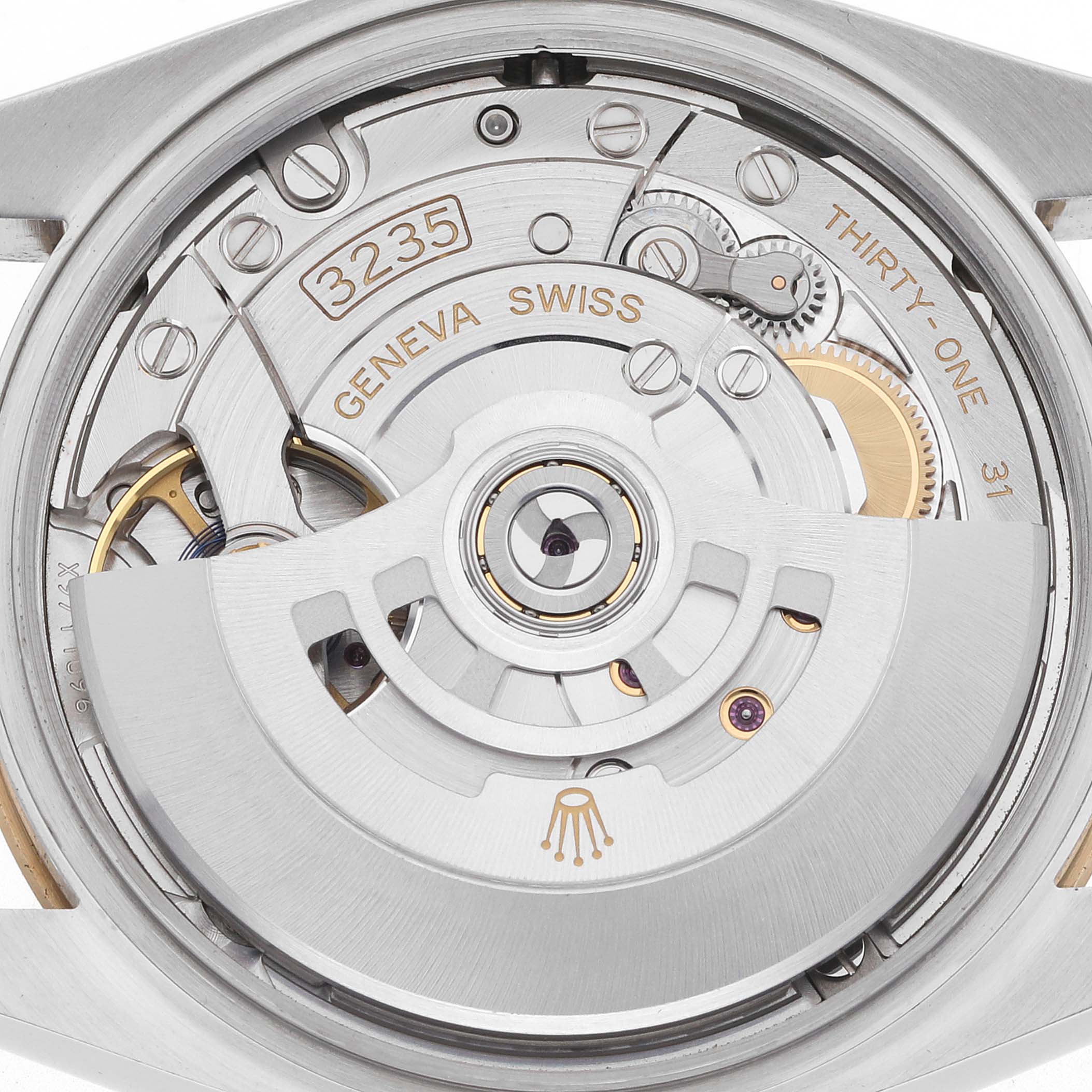 This image shows the movement of a Rolex Datejust 126233 Men's Steel and Gold (two tone) Silver Dial watch, highlighting the rotor and gear components from a rear angle.